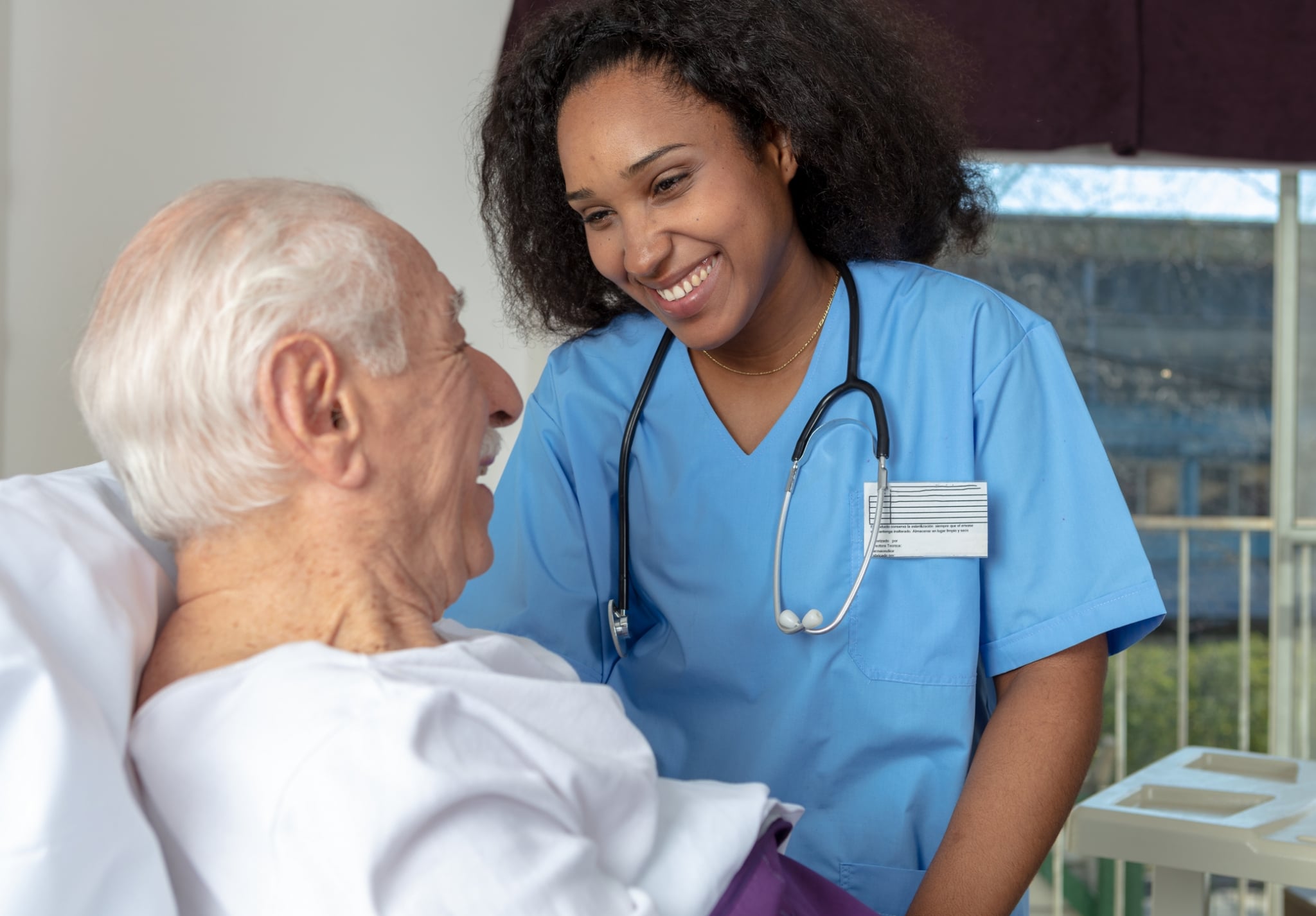 Nurse smiling at patient