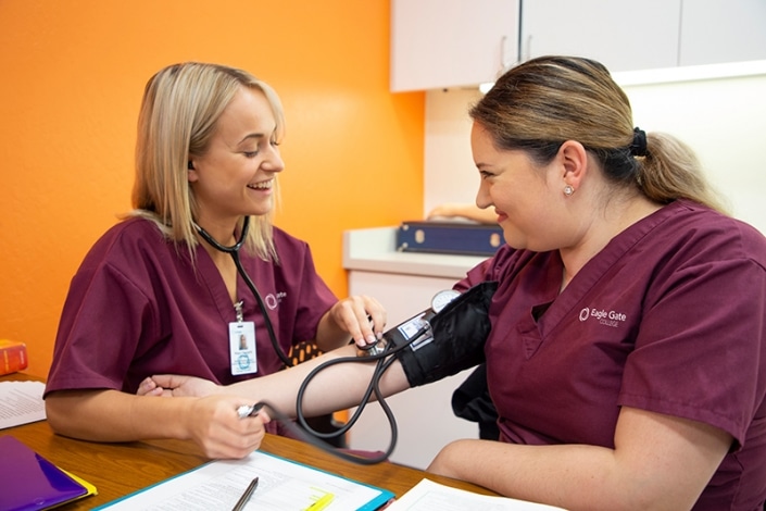 Student having her blood pressure measured