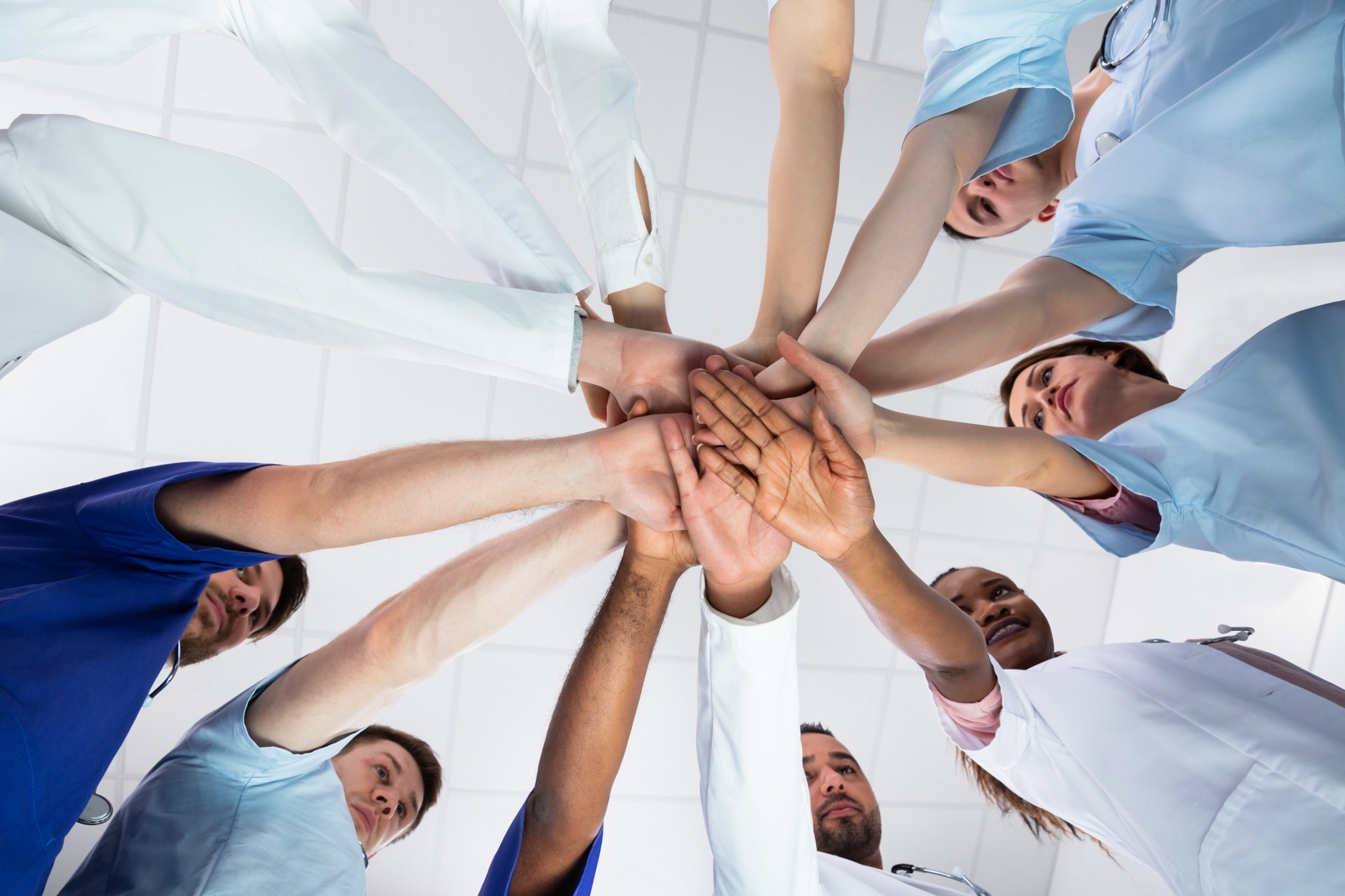 Healthcare team touching hands