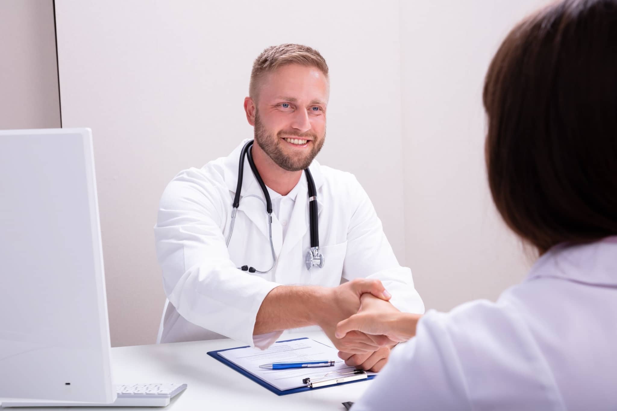 Healthcare professionals shaking hands