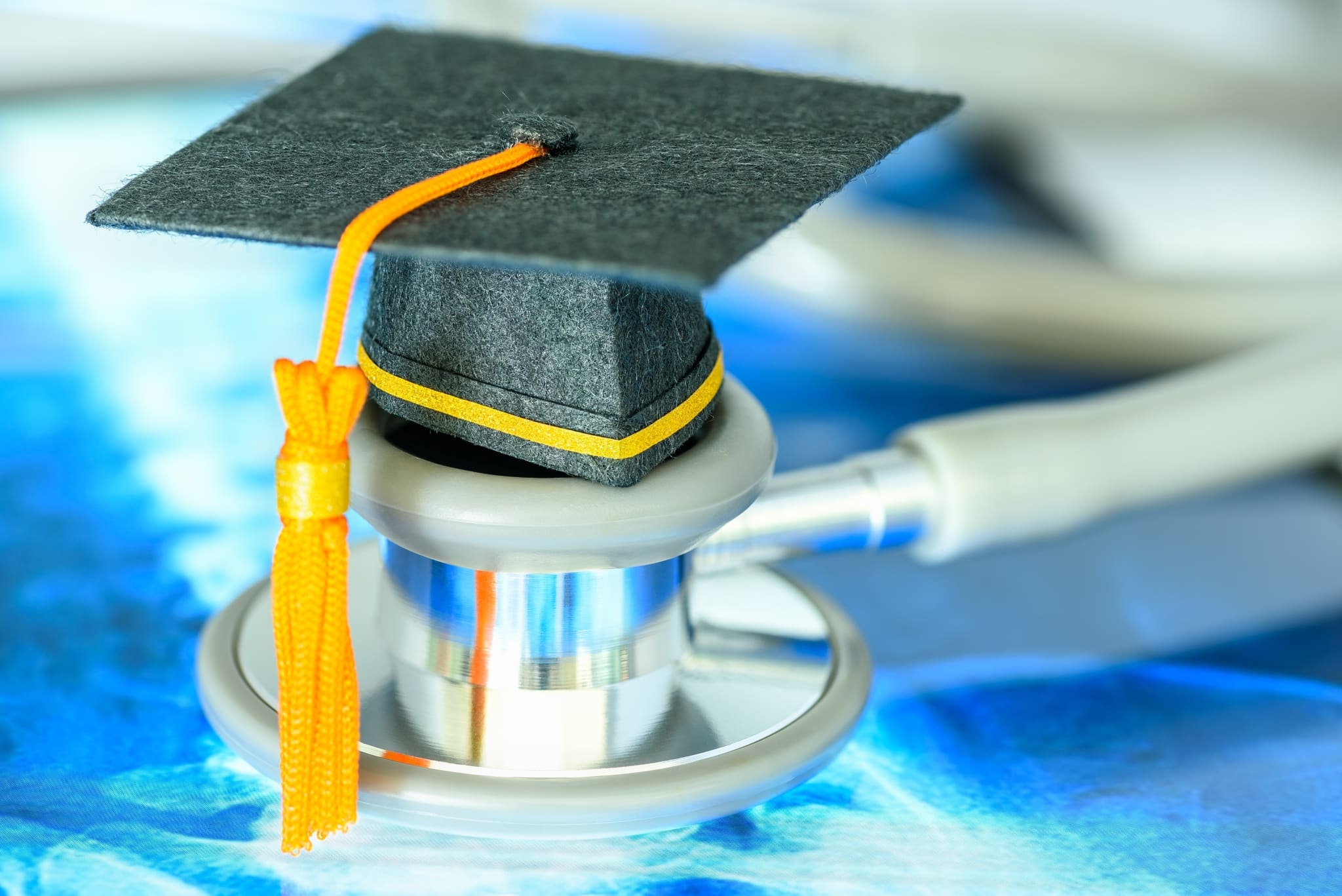 Close up of graduation cap on a stethoscope
