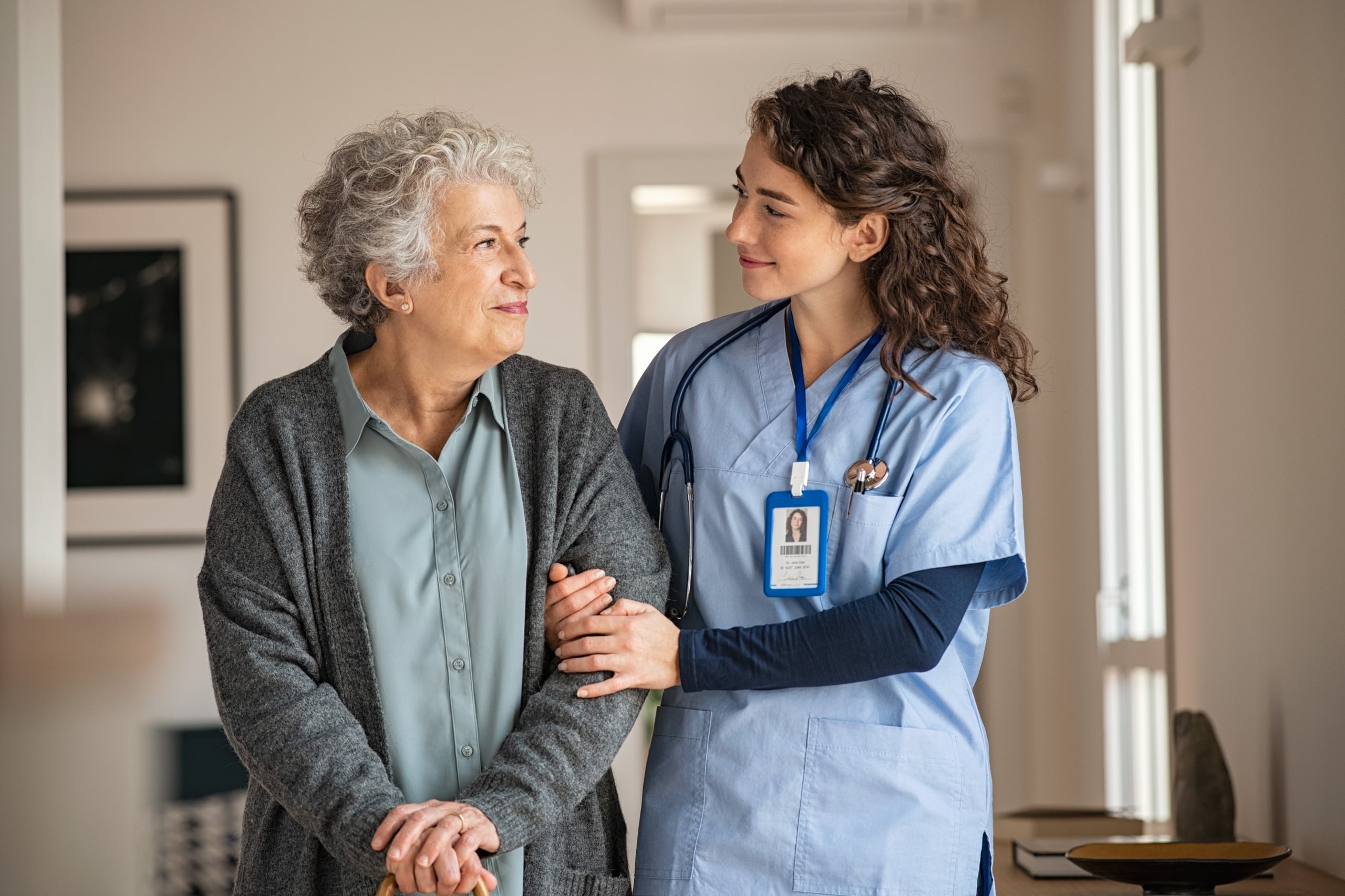 Caregiver helping elderly patient