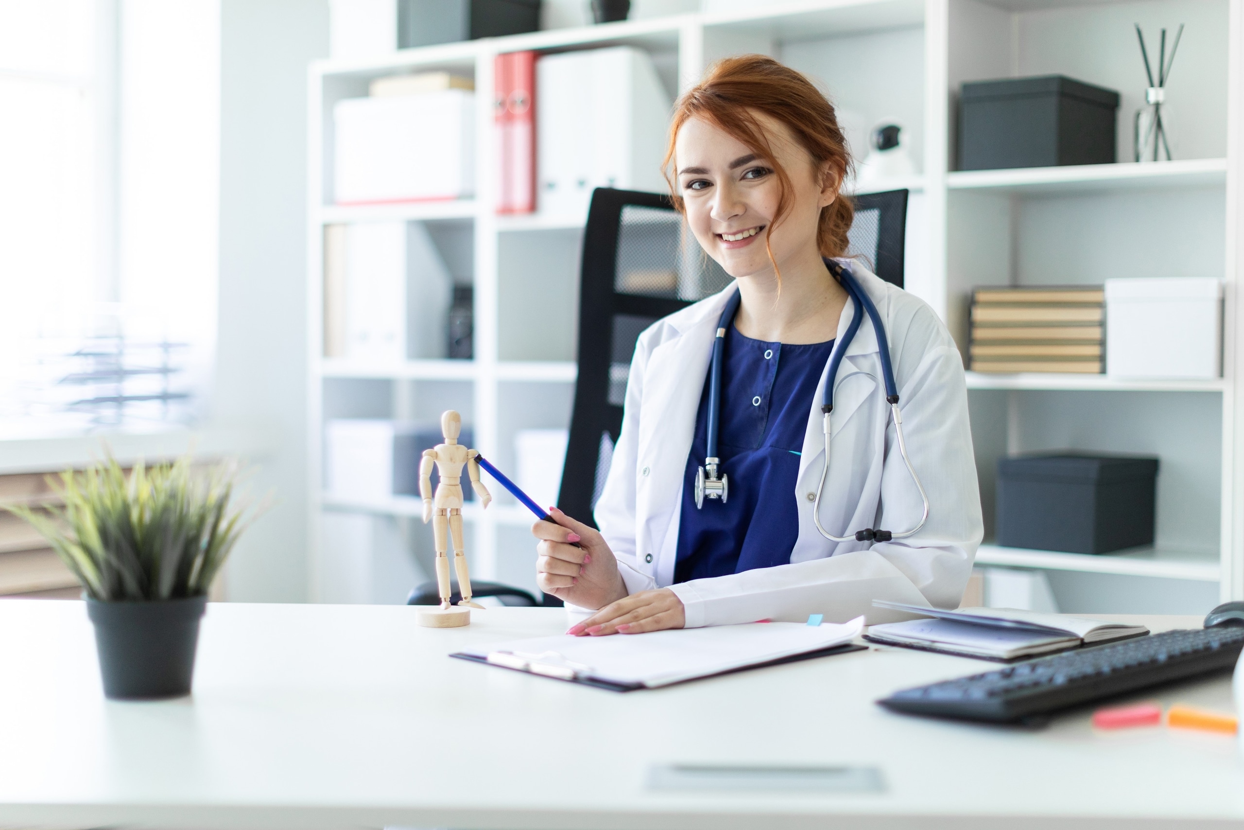 Young medical professional at a desk