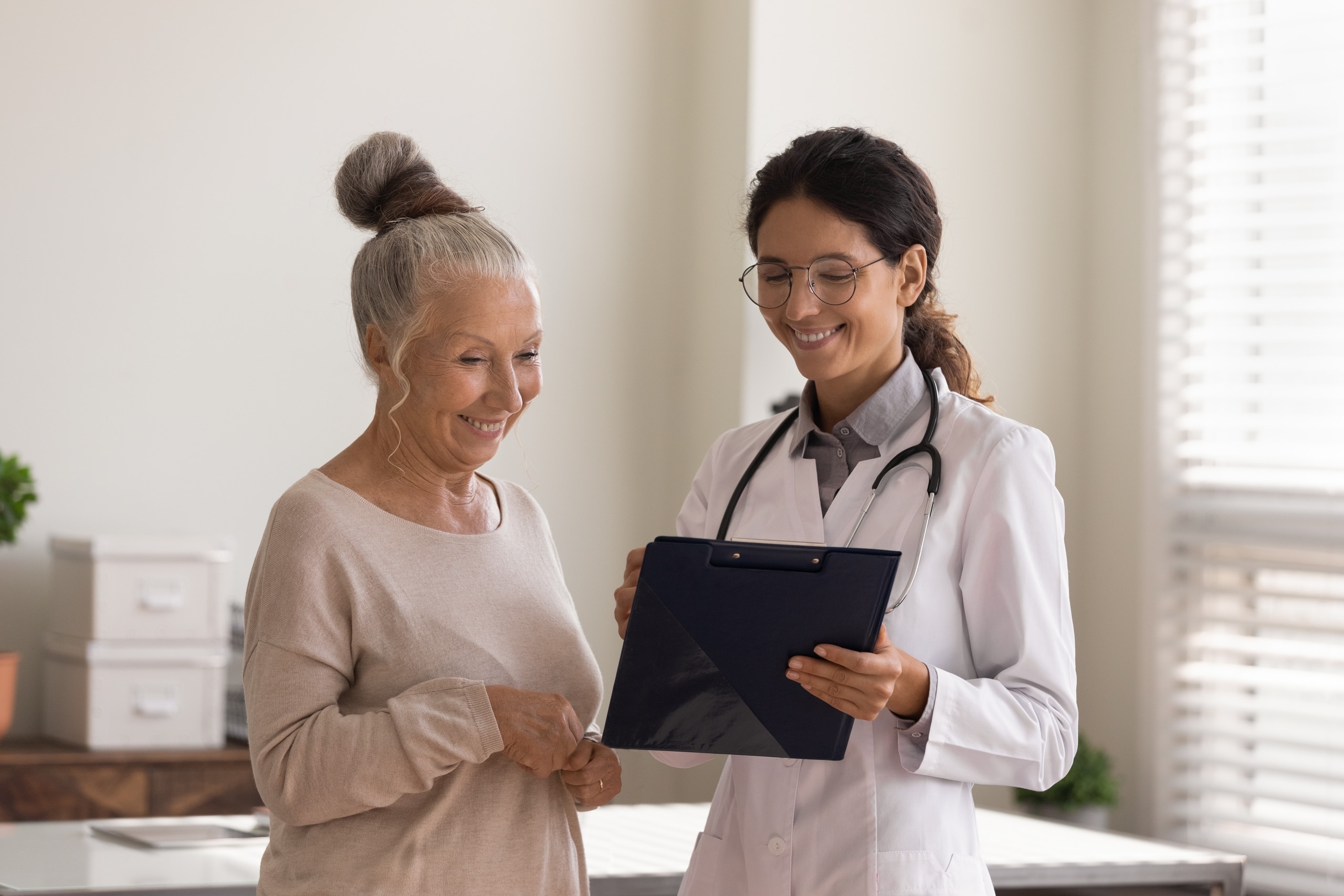 Nurse practitioner with an elderly patient