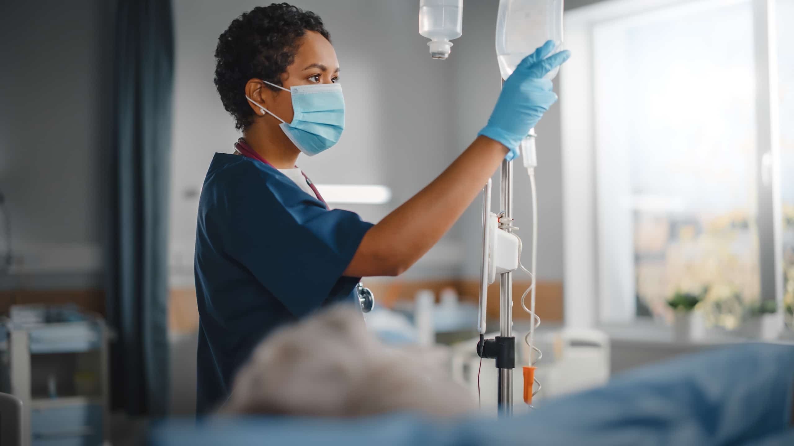 Medical professional checking IVs