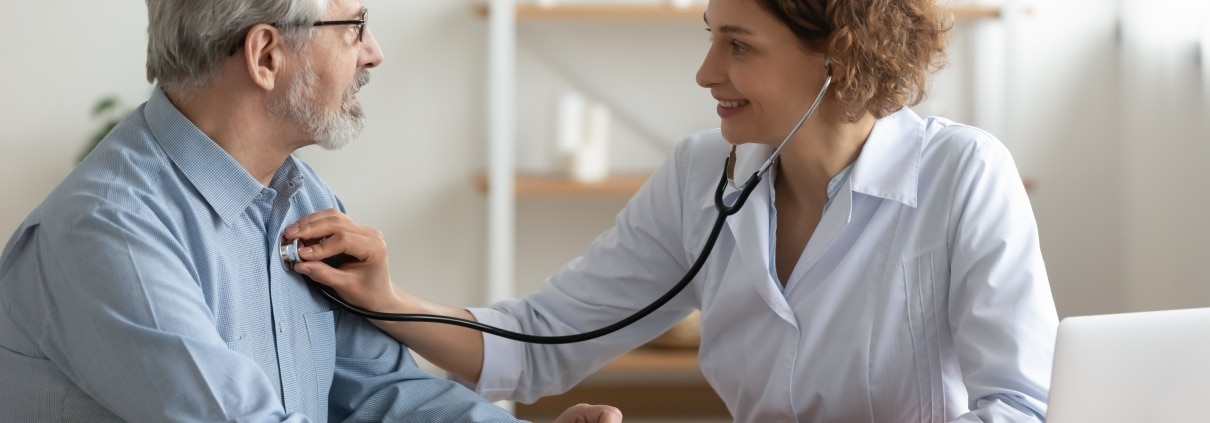 Nurse taking a man's heartrate