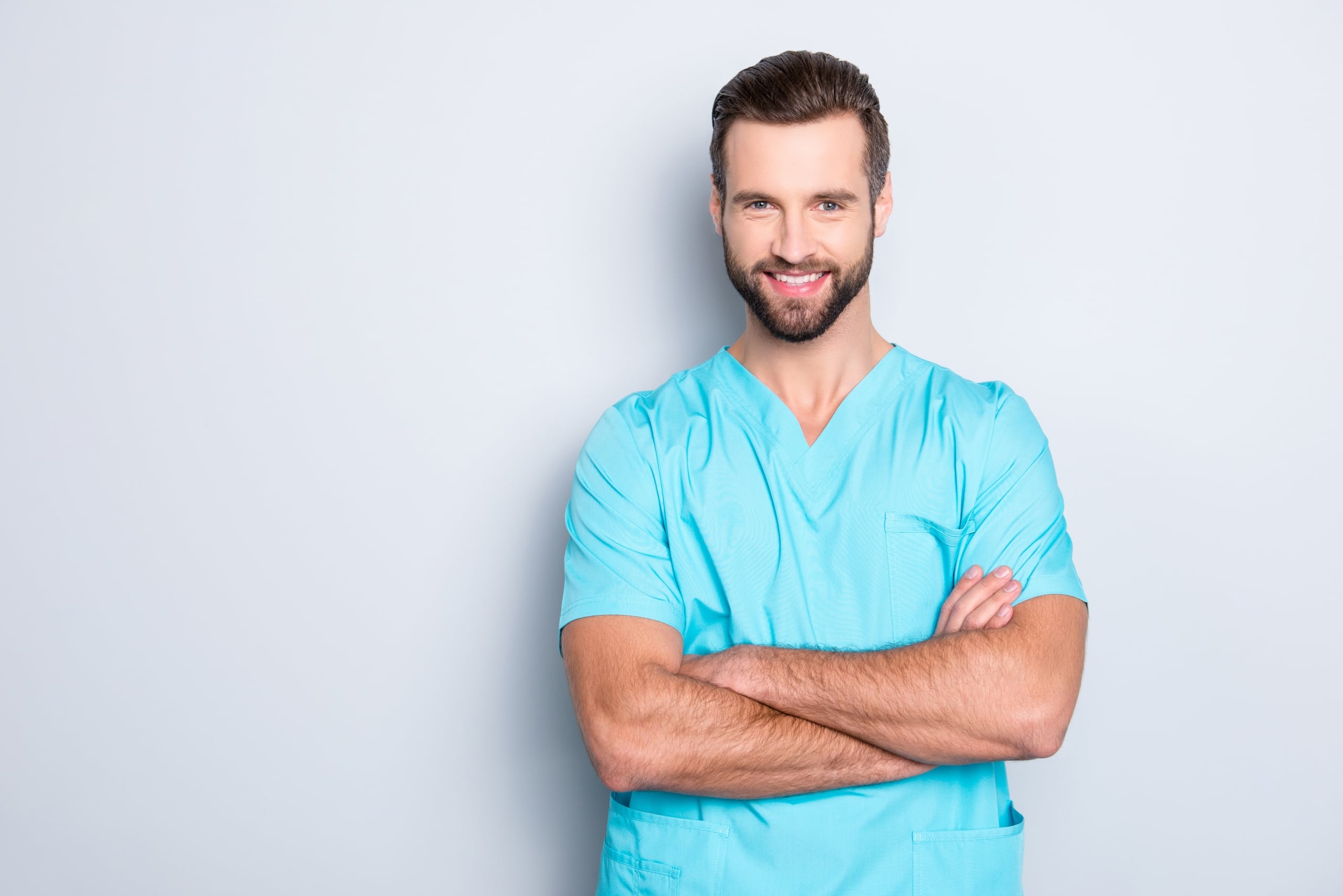 Male healthcare worker against a white backdrop