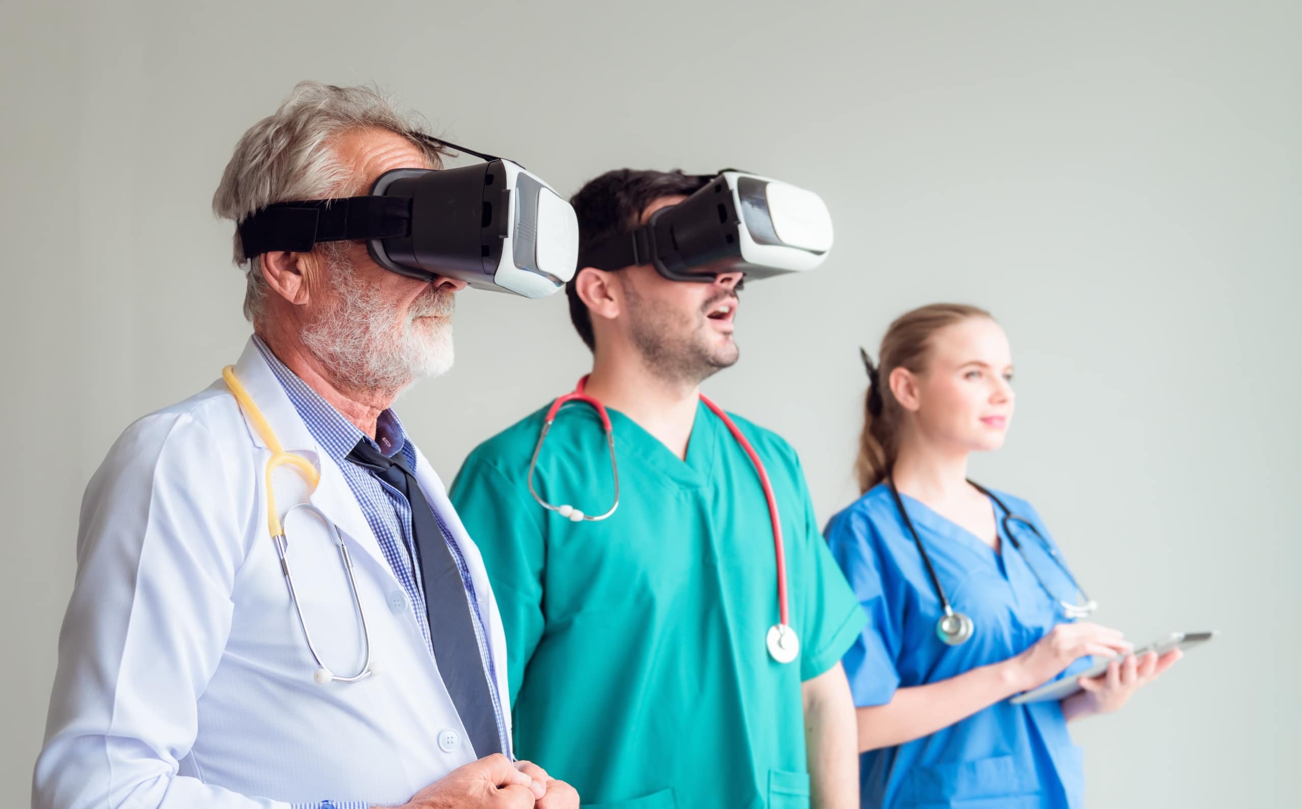 Group of medial professionals using virtual reality goggles
