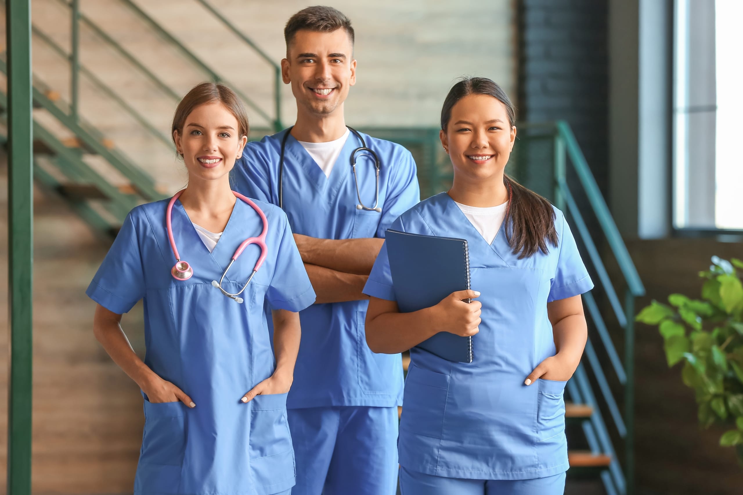 Group of medical students in scrubs