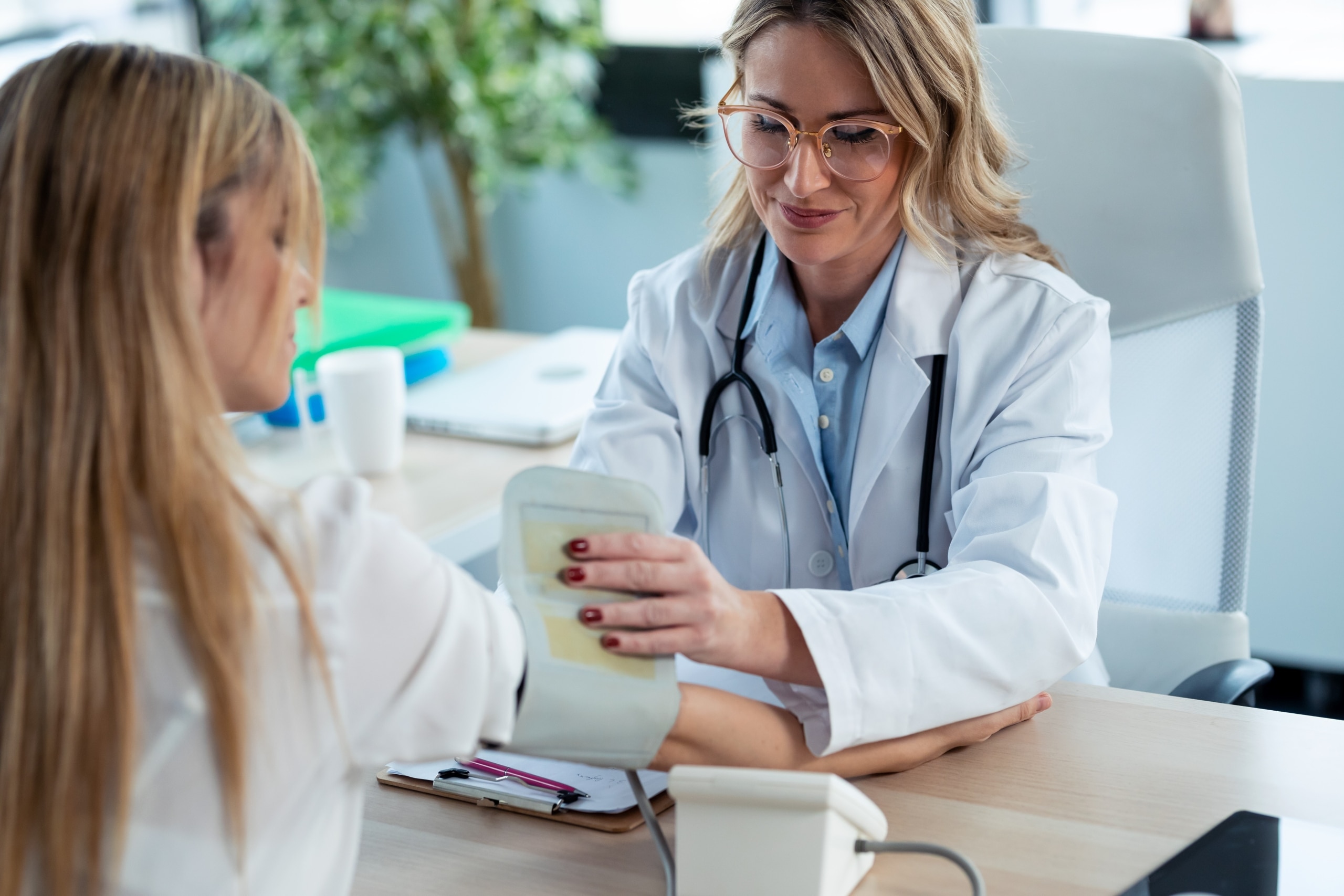 Medical professional taking a patient's blood pressure
