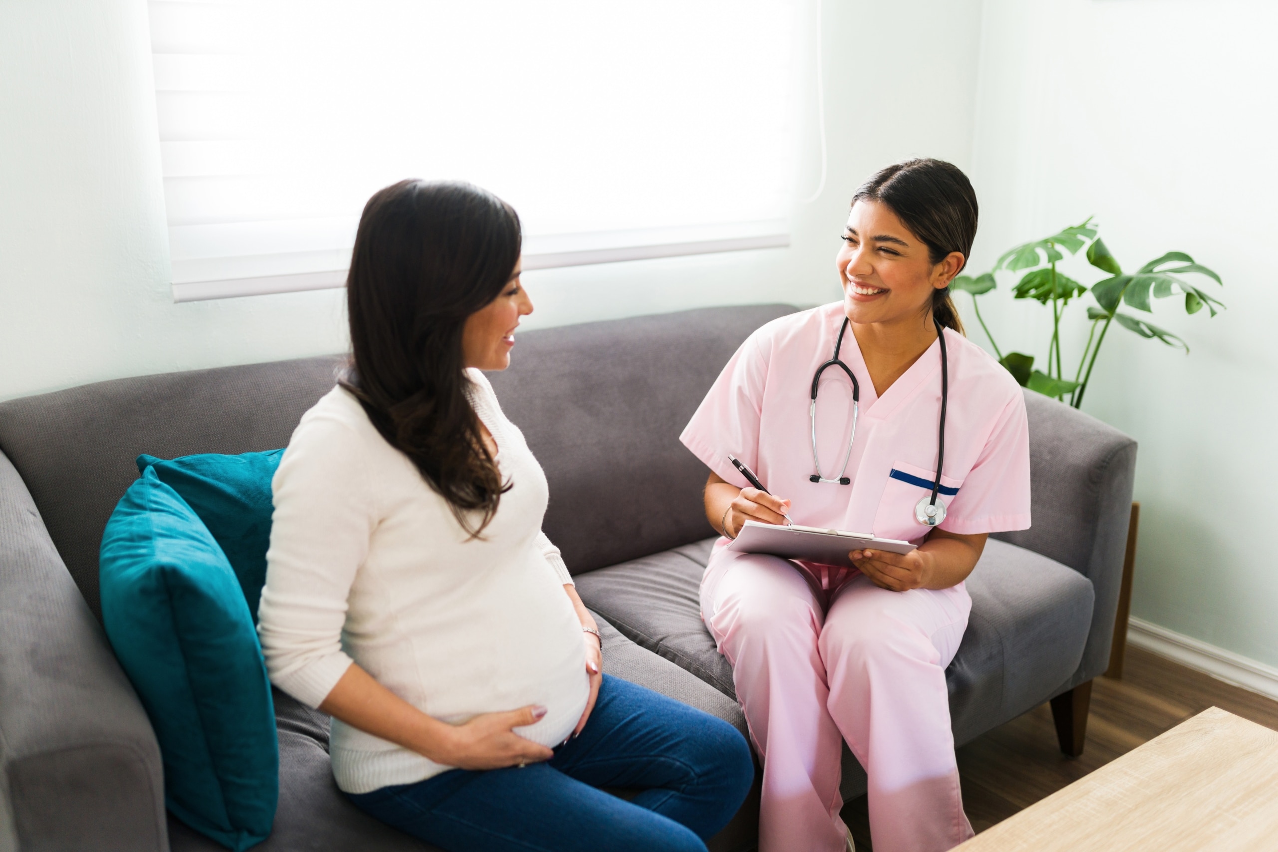 Nurse midwife with a pregnant patient