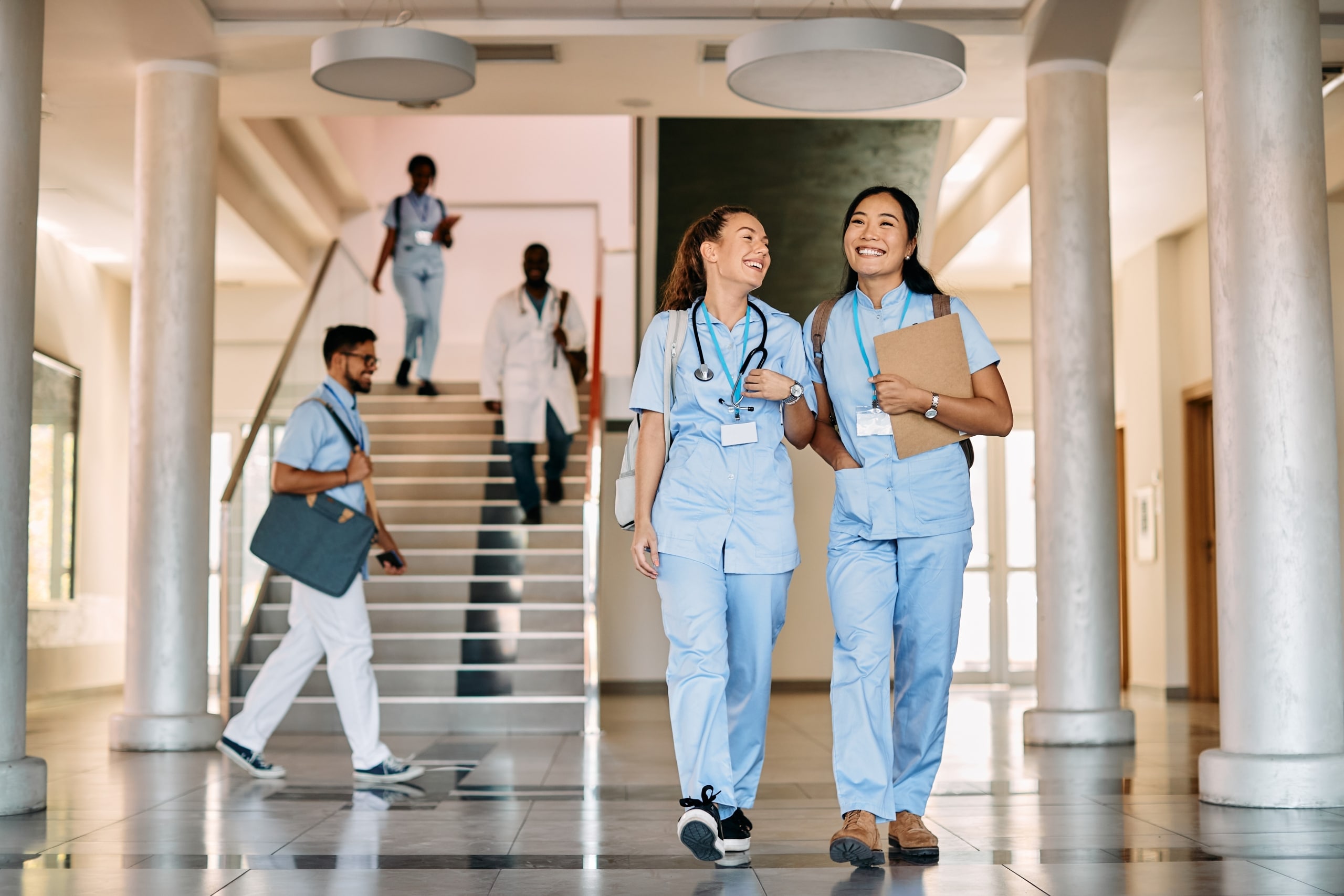 Two nursing students walking in a hallway