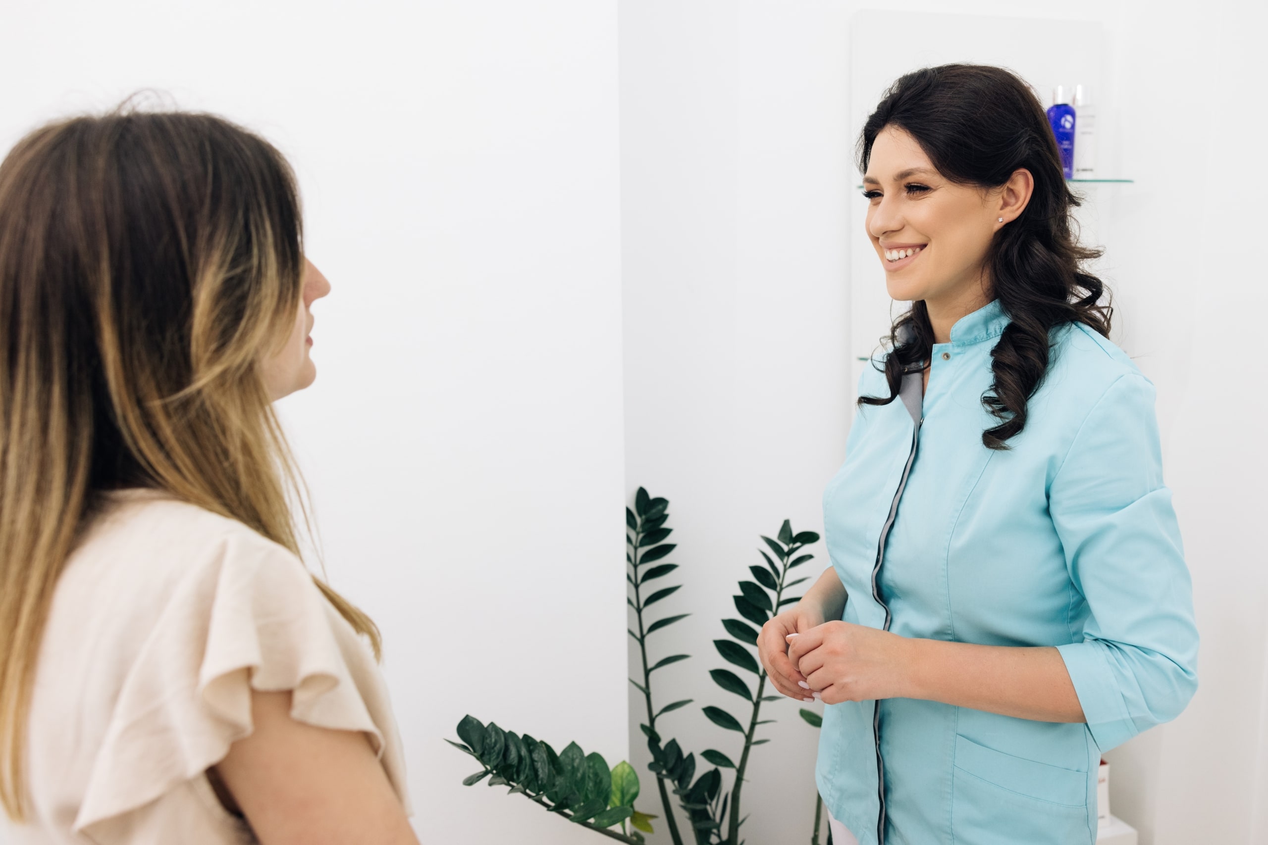 Smiling medical professional with a client in a clinic