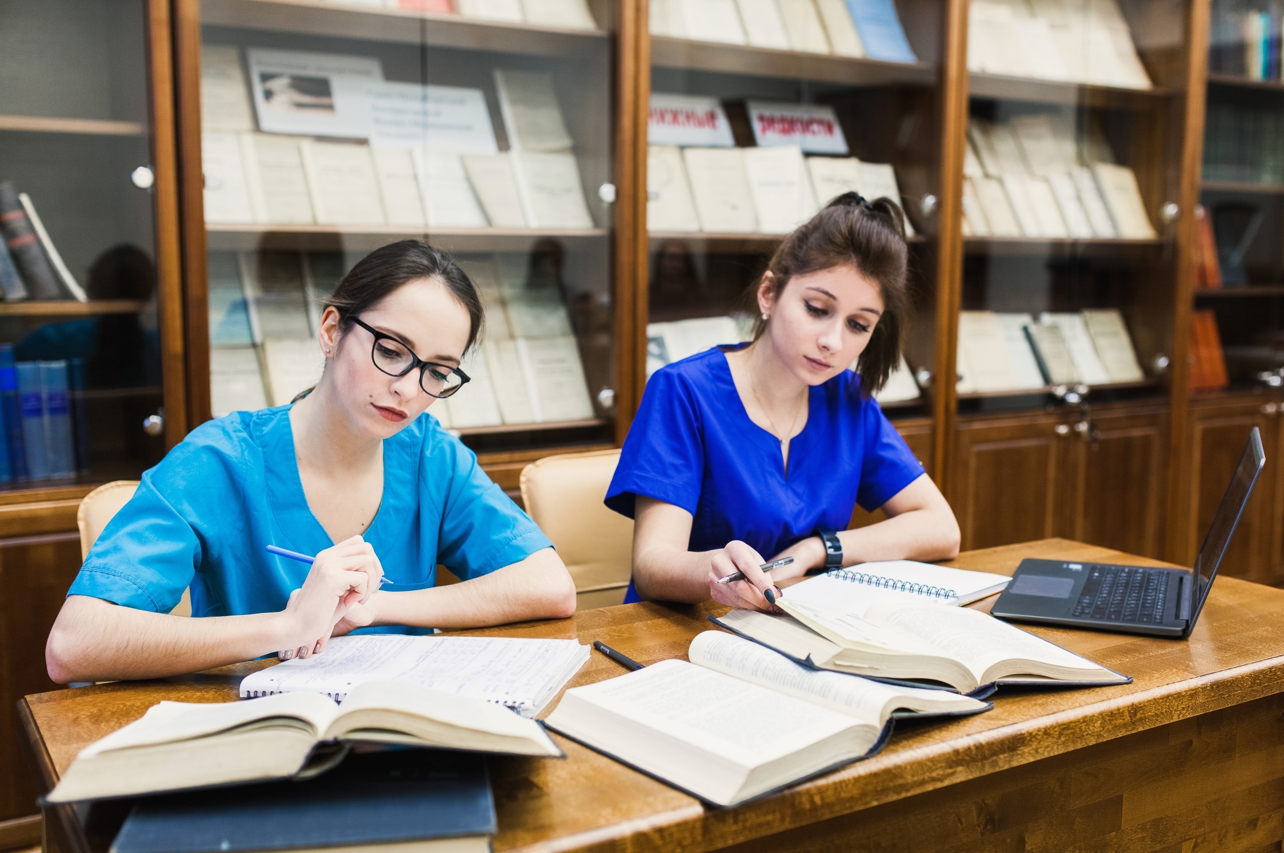 Female nursing students studying at a table