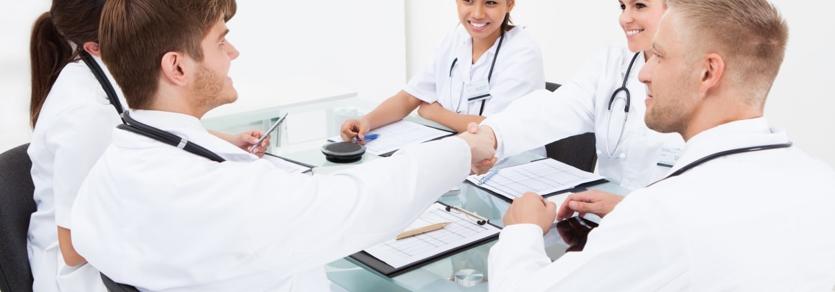 Group of medical professionals at a conference table