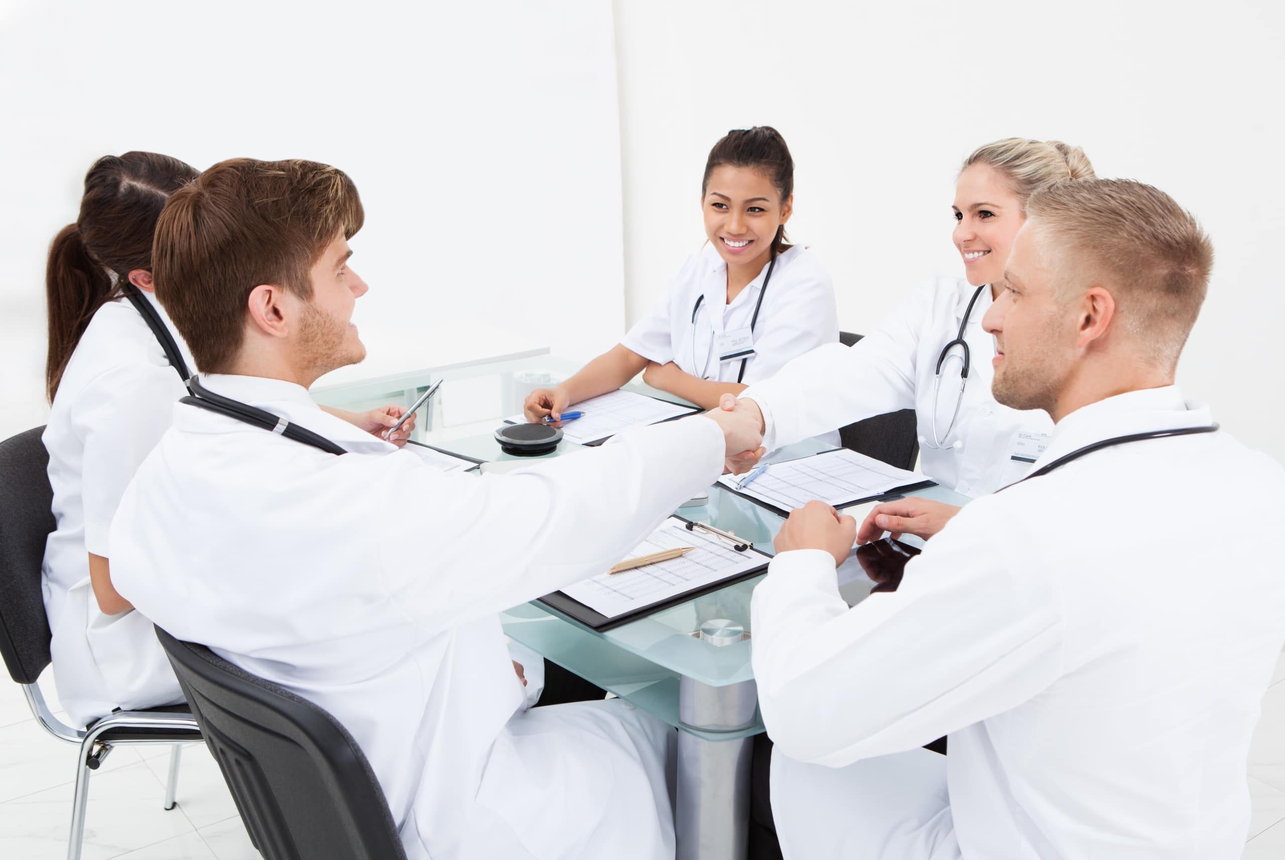 Group of medical professionals around a conference table