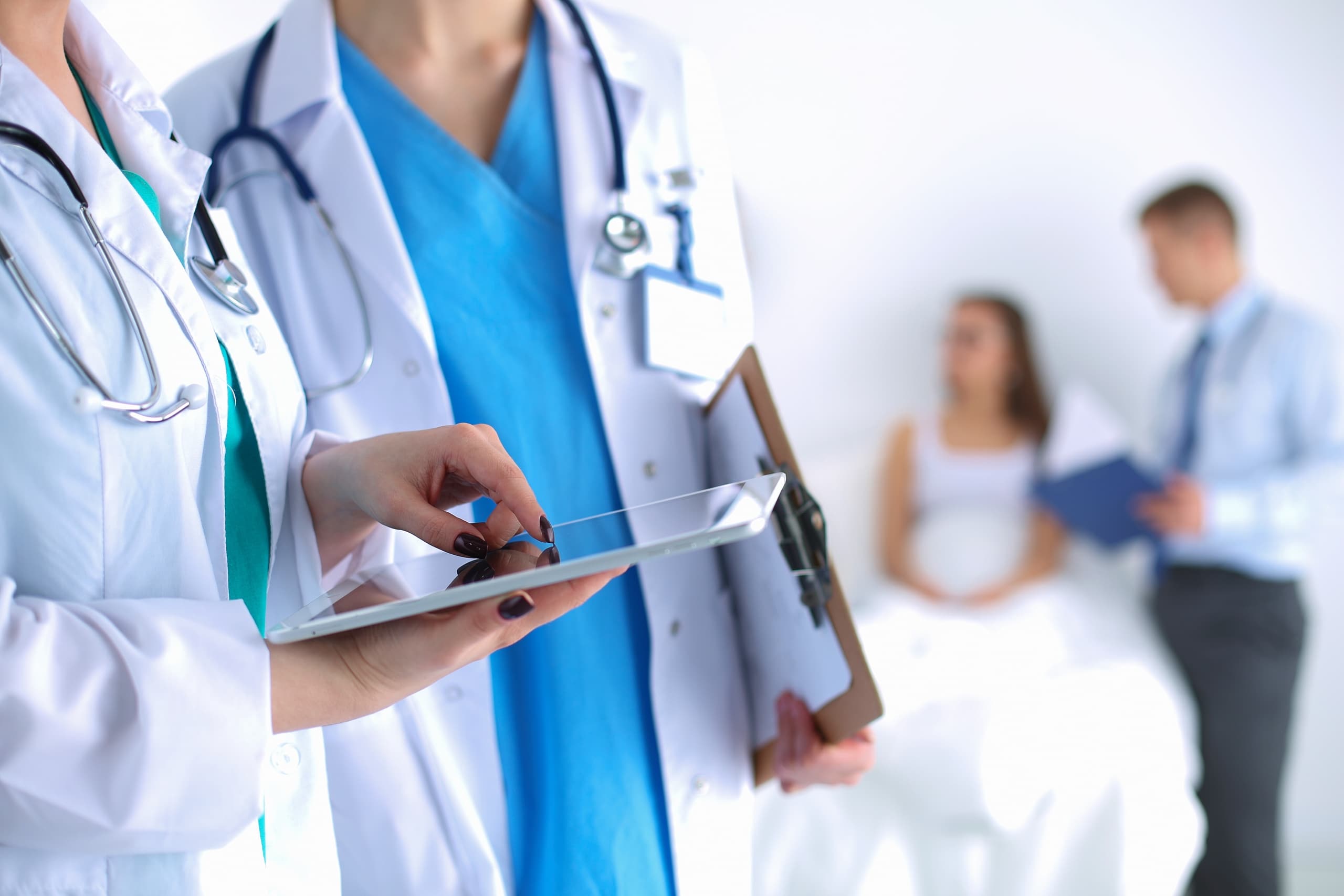 Close up of medical professionals using a tablet
