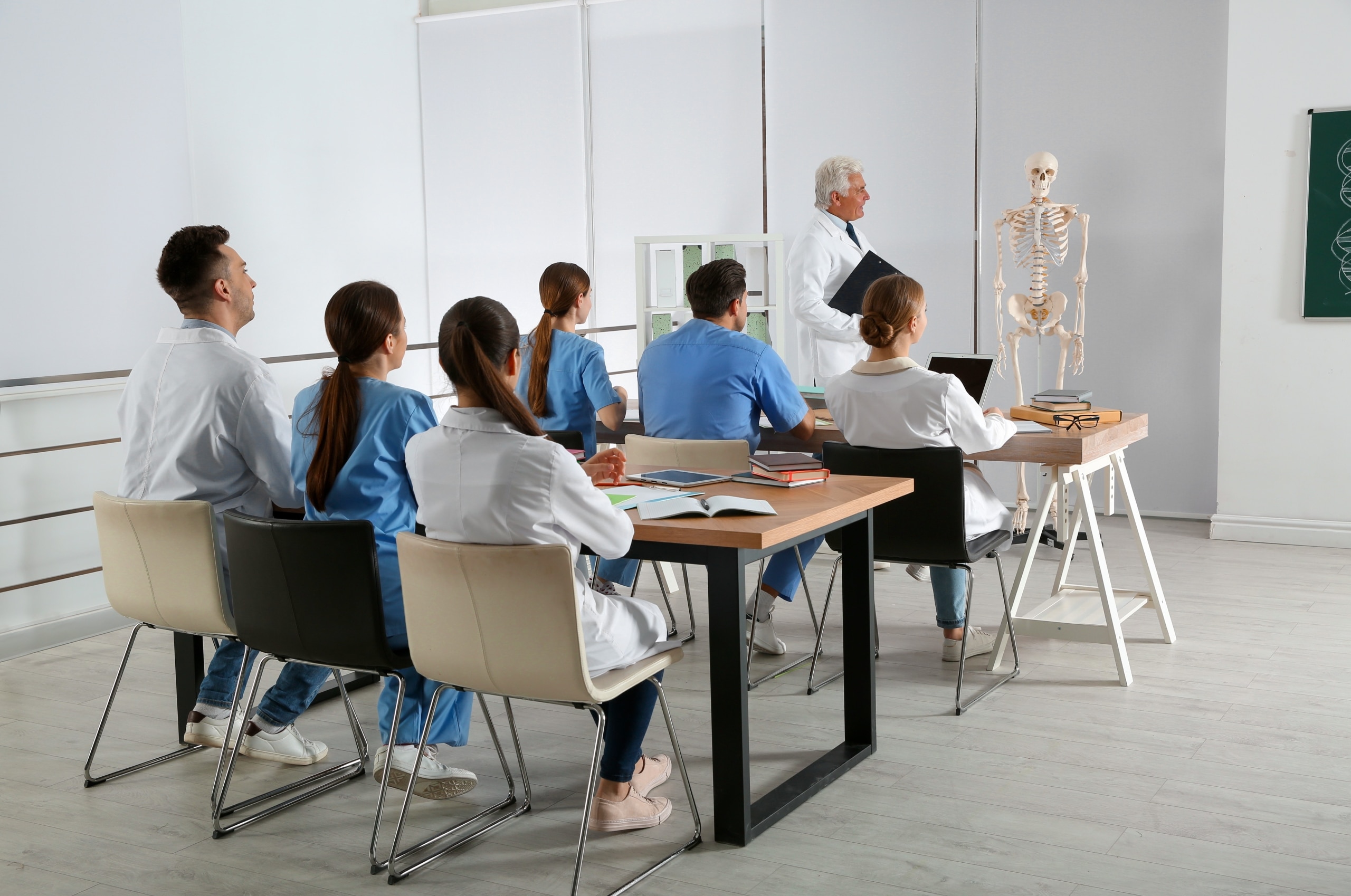 Medical students looking at their instructor