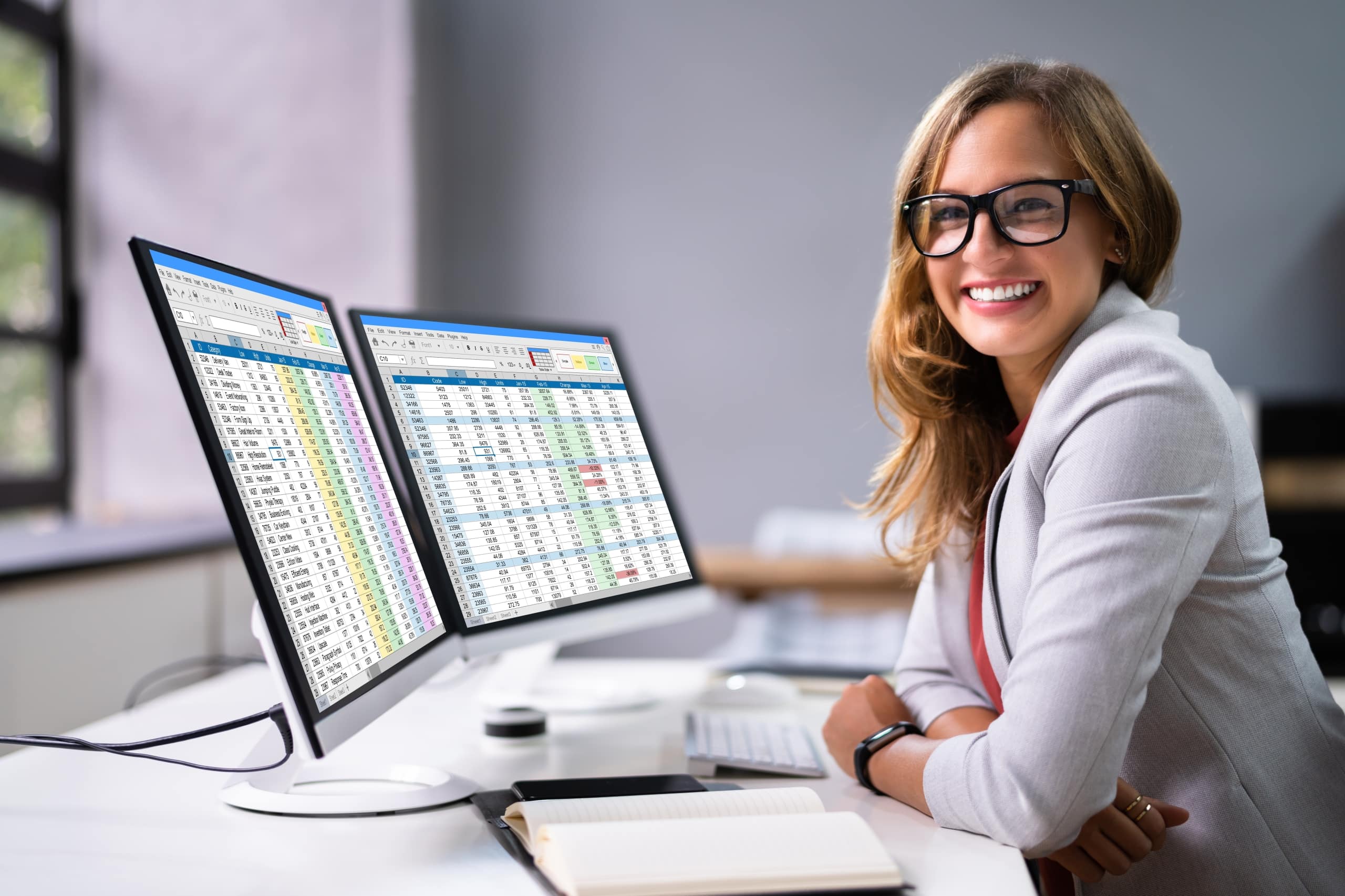 Medical office professional smiling at a desk