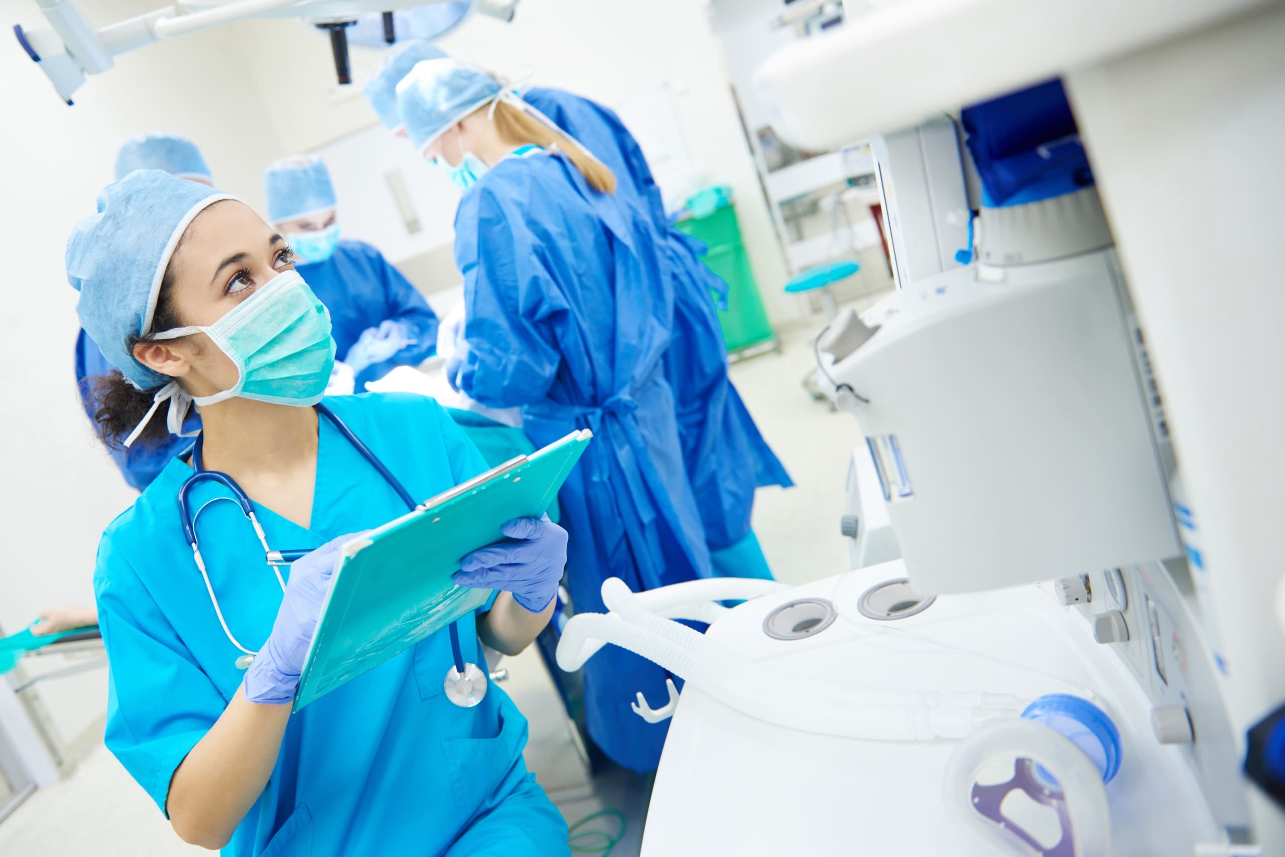 Surgical Tech with a clipboard in the OR