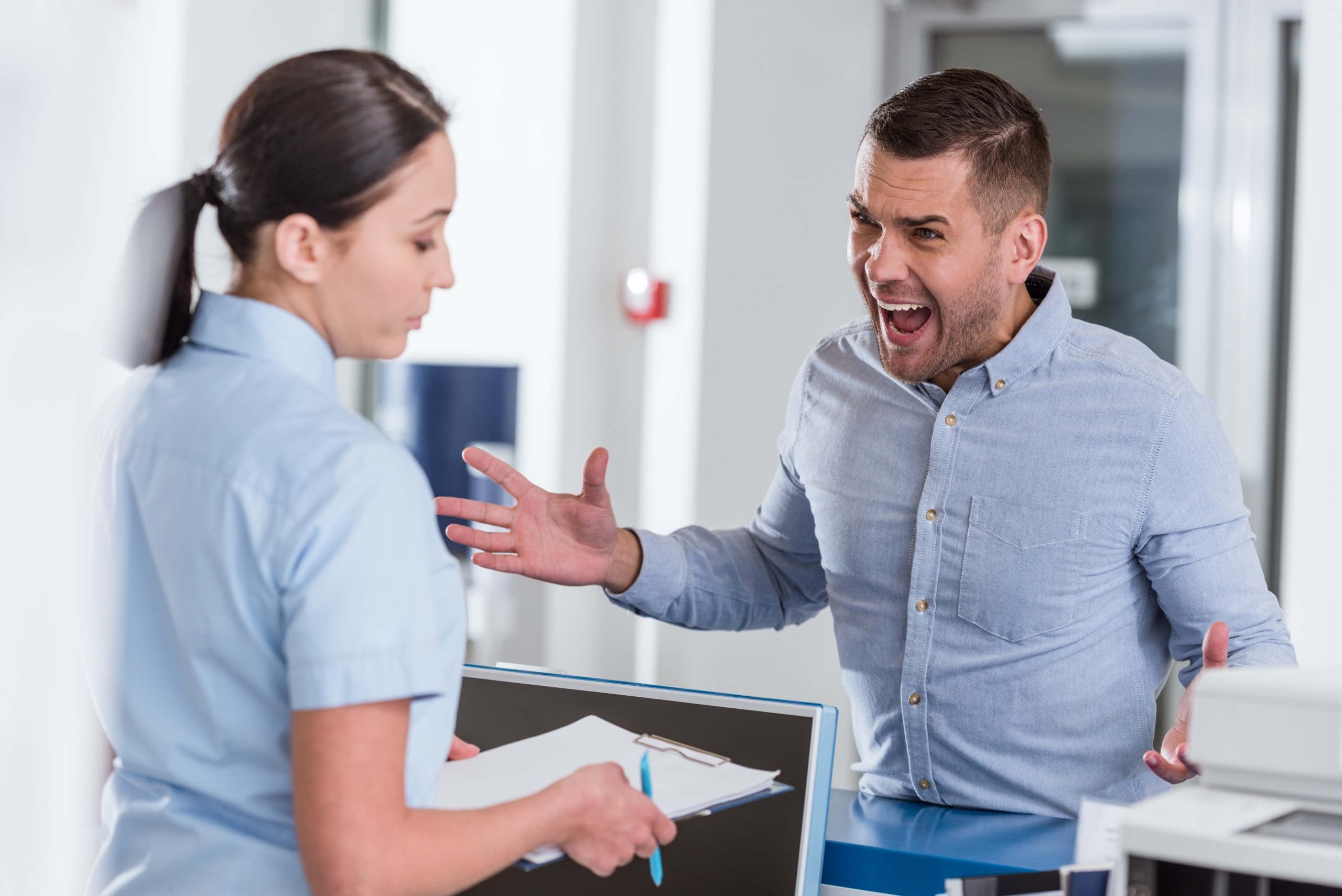 Nurse dealing with an angry male patient