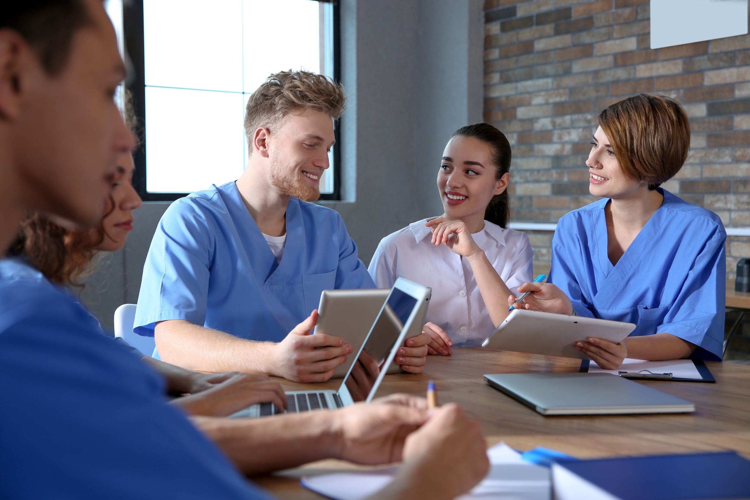 Group of nurses sitting at a table