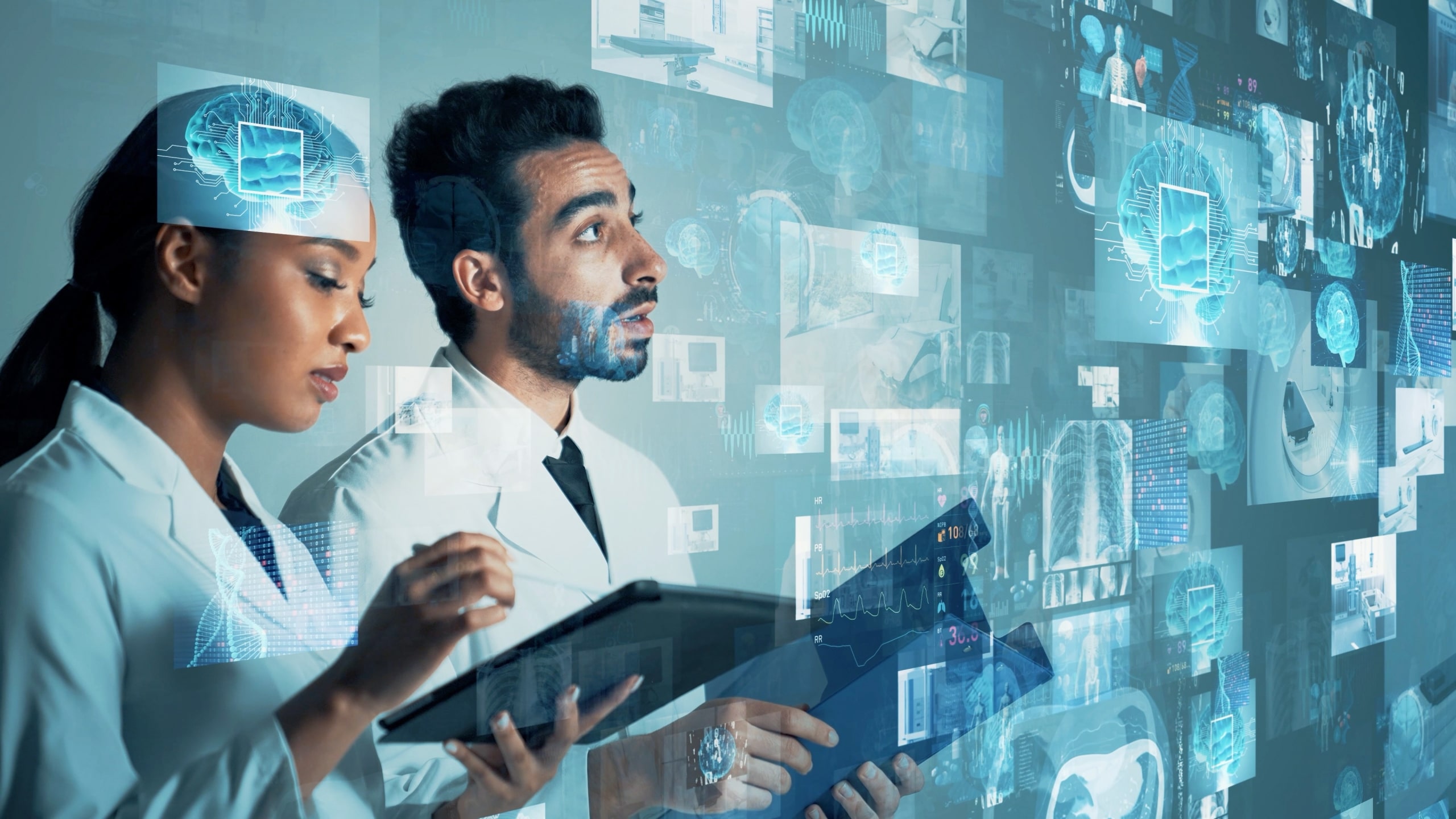 Two medical professionals using virtual technology