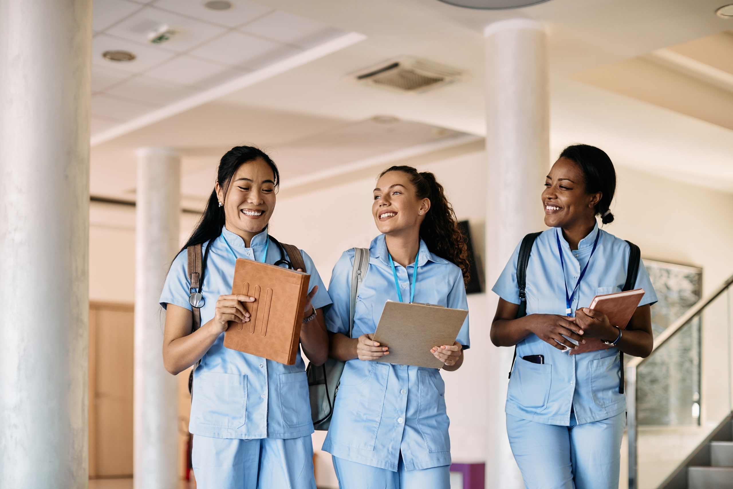 Group of smiling medical students in a hallway