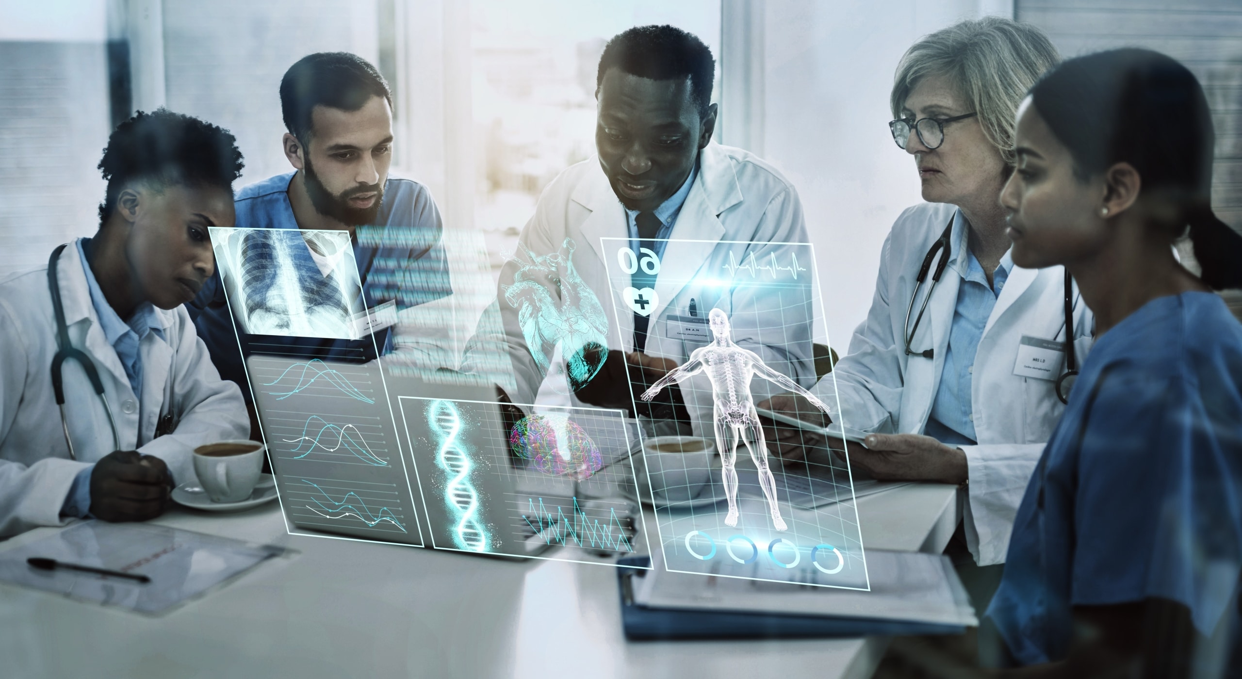 Group of medical professionals around a table with futuristic technology