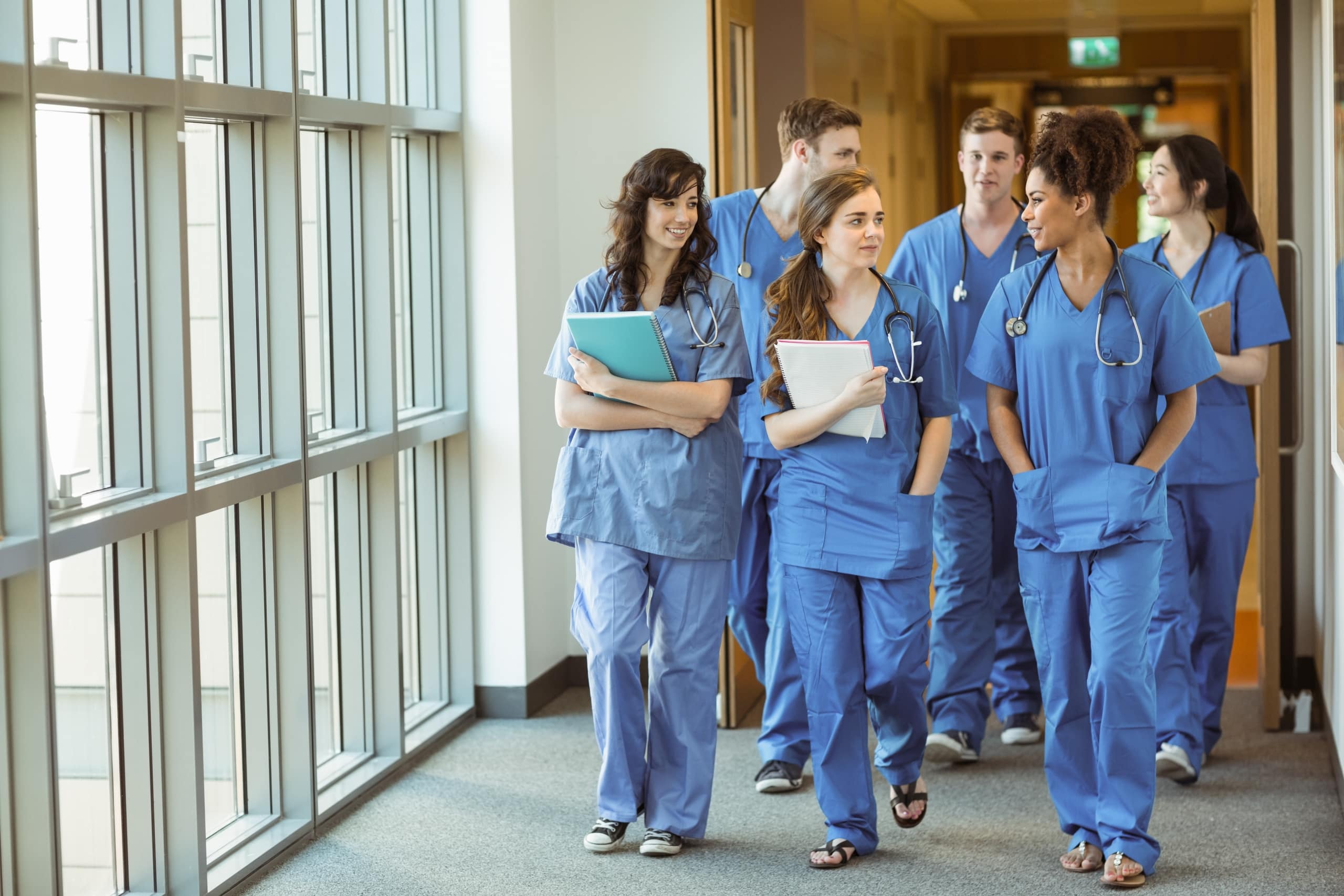 Group of medical students walking in a hallway