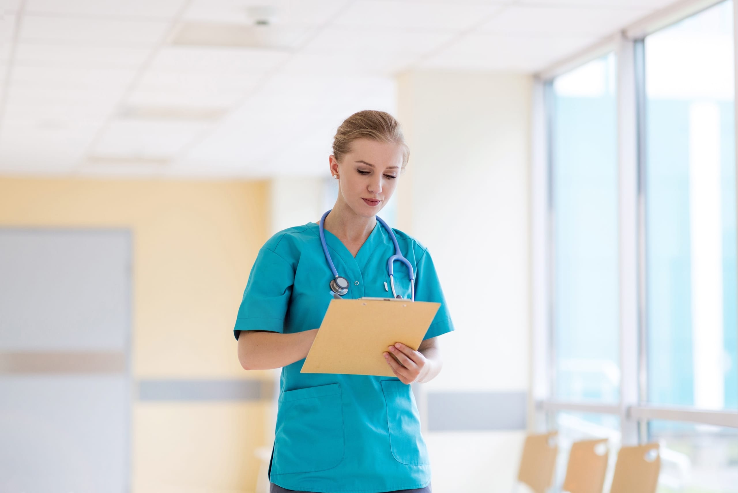 Female nurse completing paperwork at a clinic
