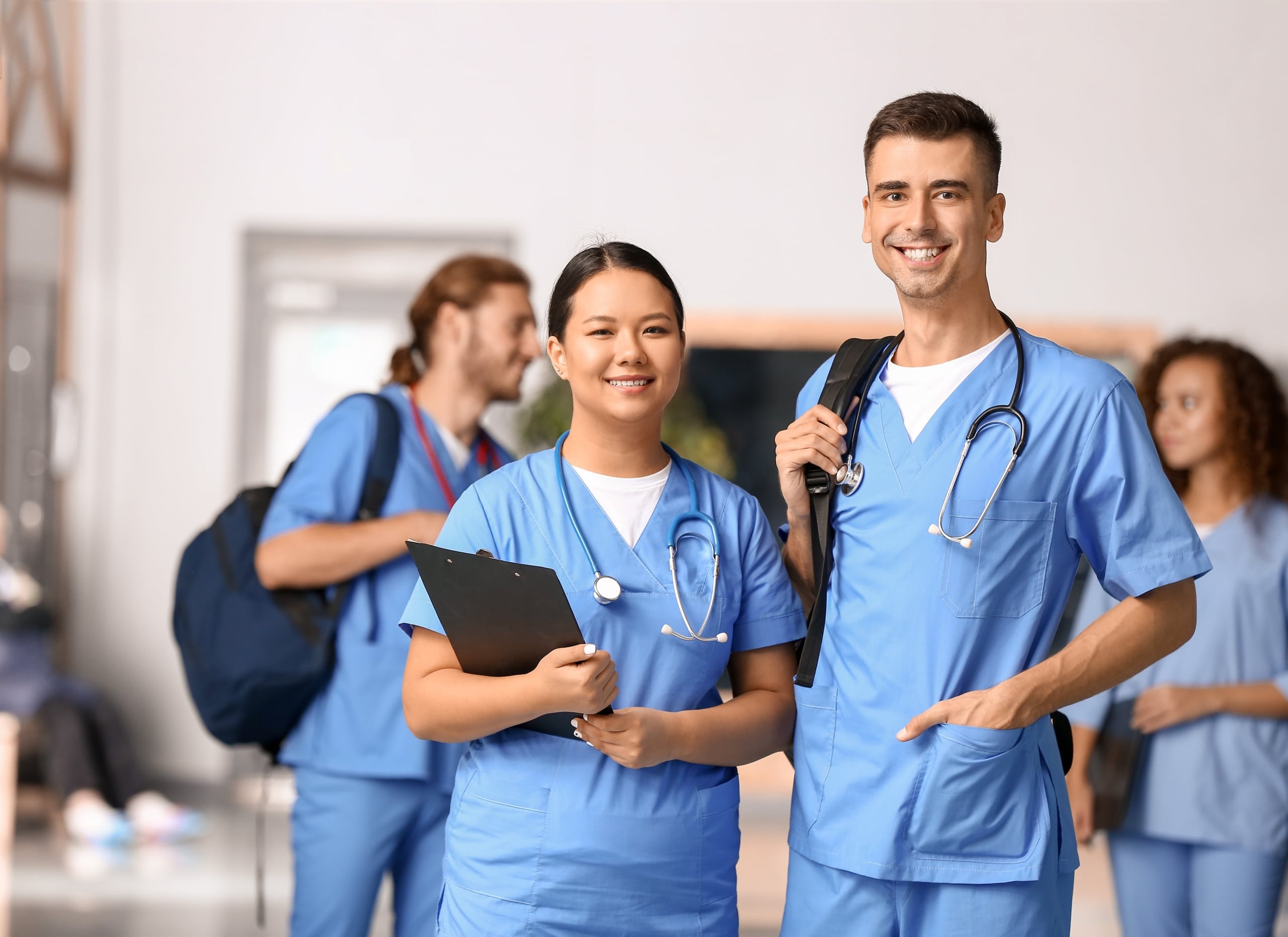 Group of diverse nursing students standing in a classroom