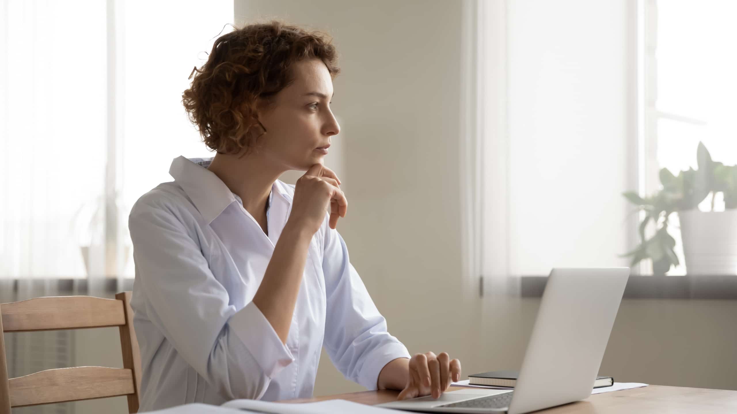Woman deep in thought looking off in the distance