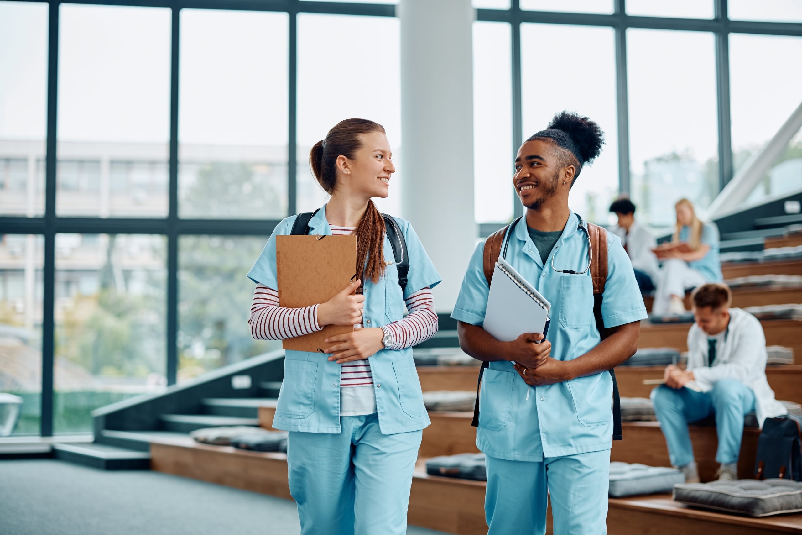 Two medical students in a lecture hall