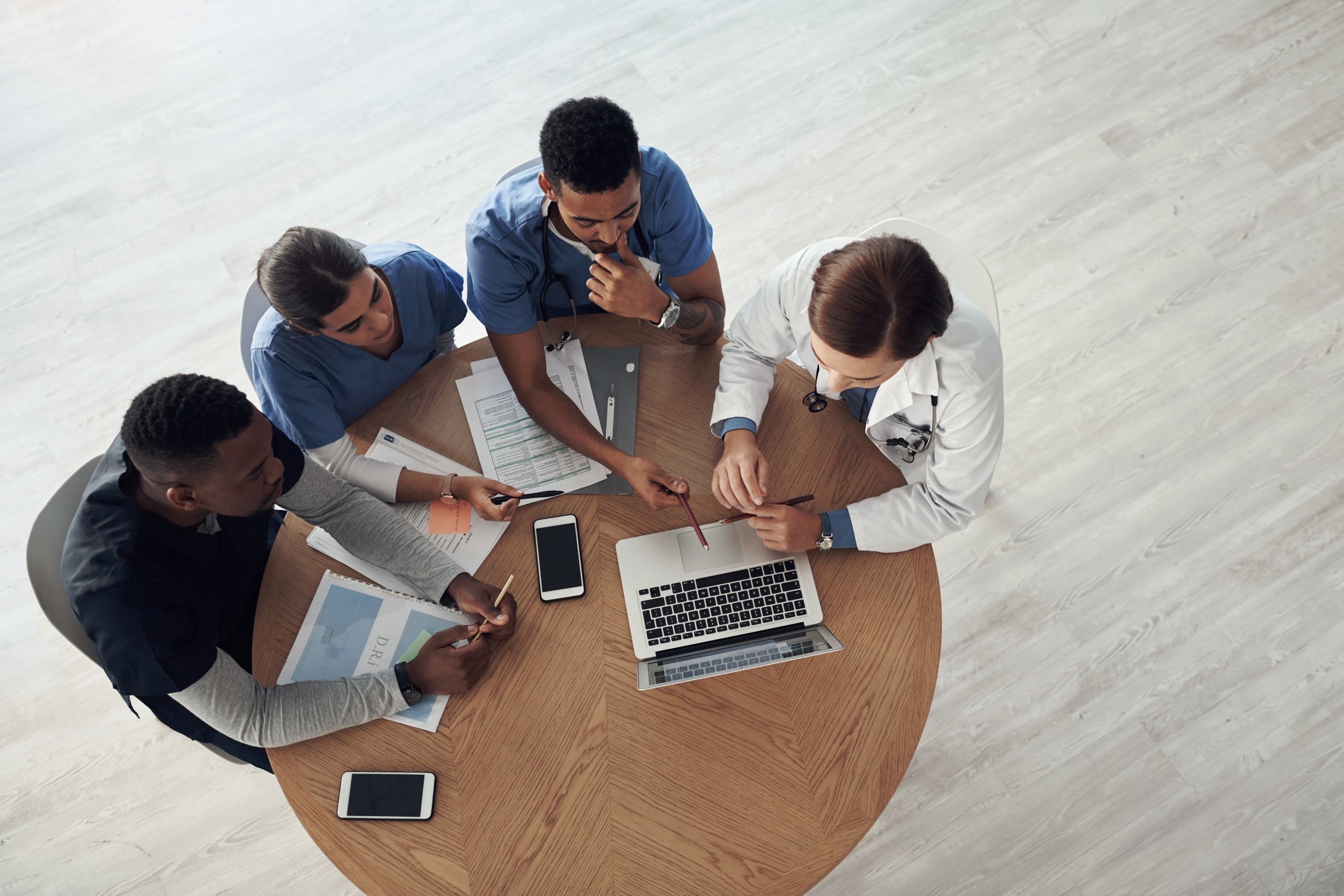 Overhead view of nursing students sitting around a table