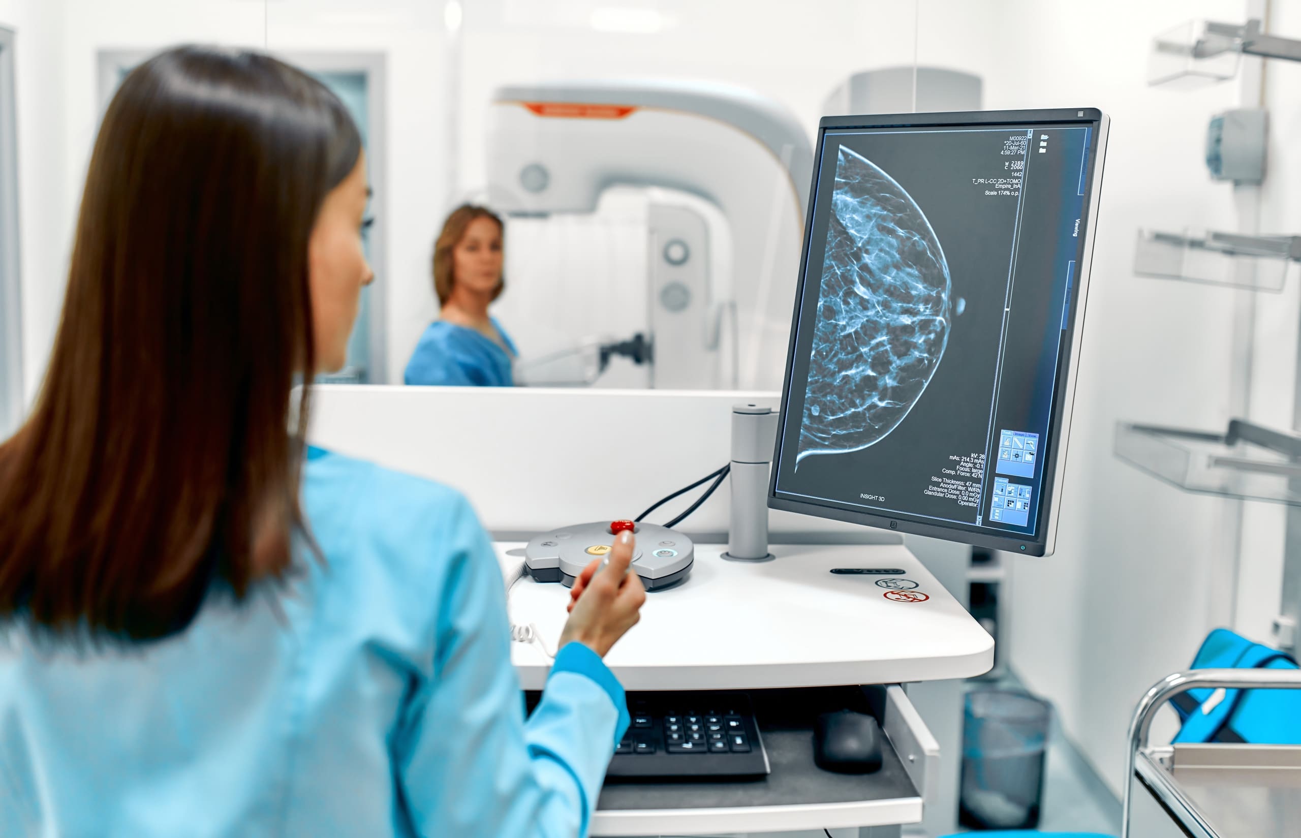 Medical professional studying the results of a mammogram