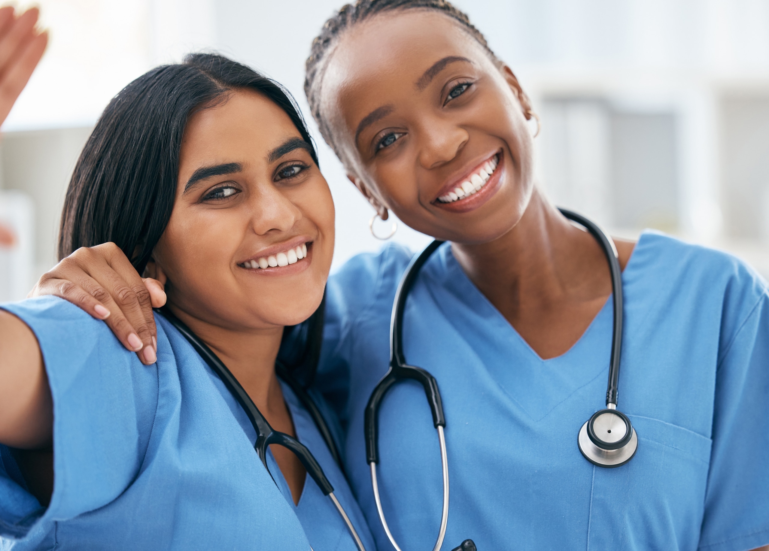 Two diverse medical professionals standing together