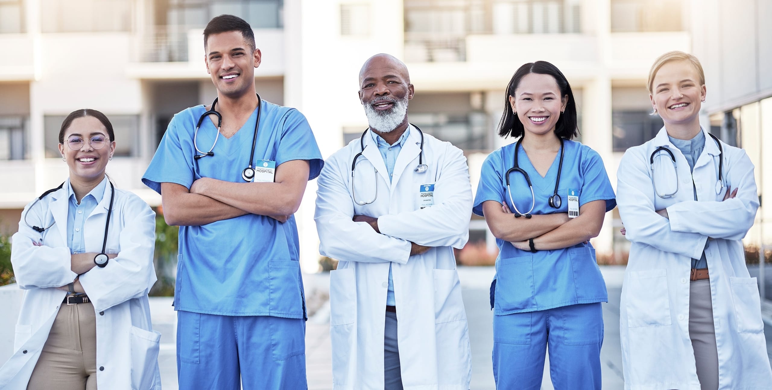 Group of diverse medical professionals standing outside
