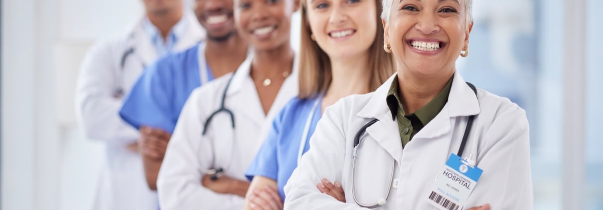 Group of diverse medical professionals standing in a line