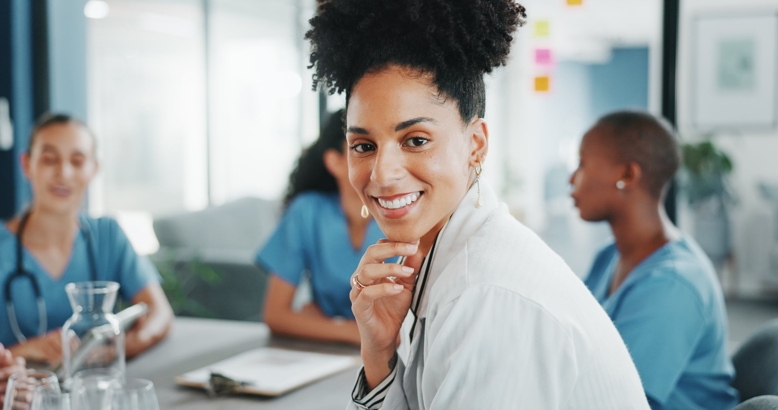 African-American medical professional smiling in a conference room
