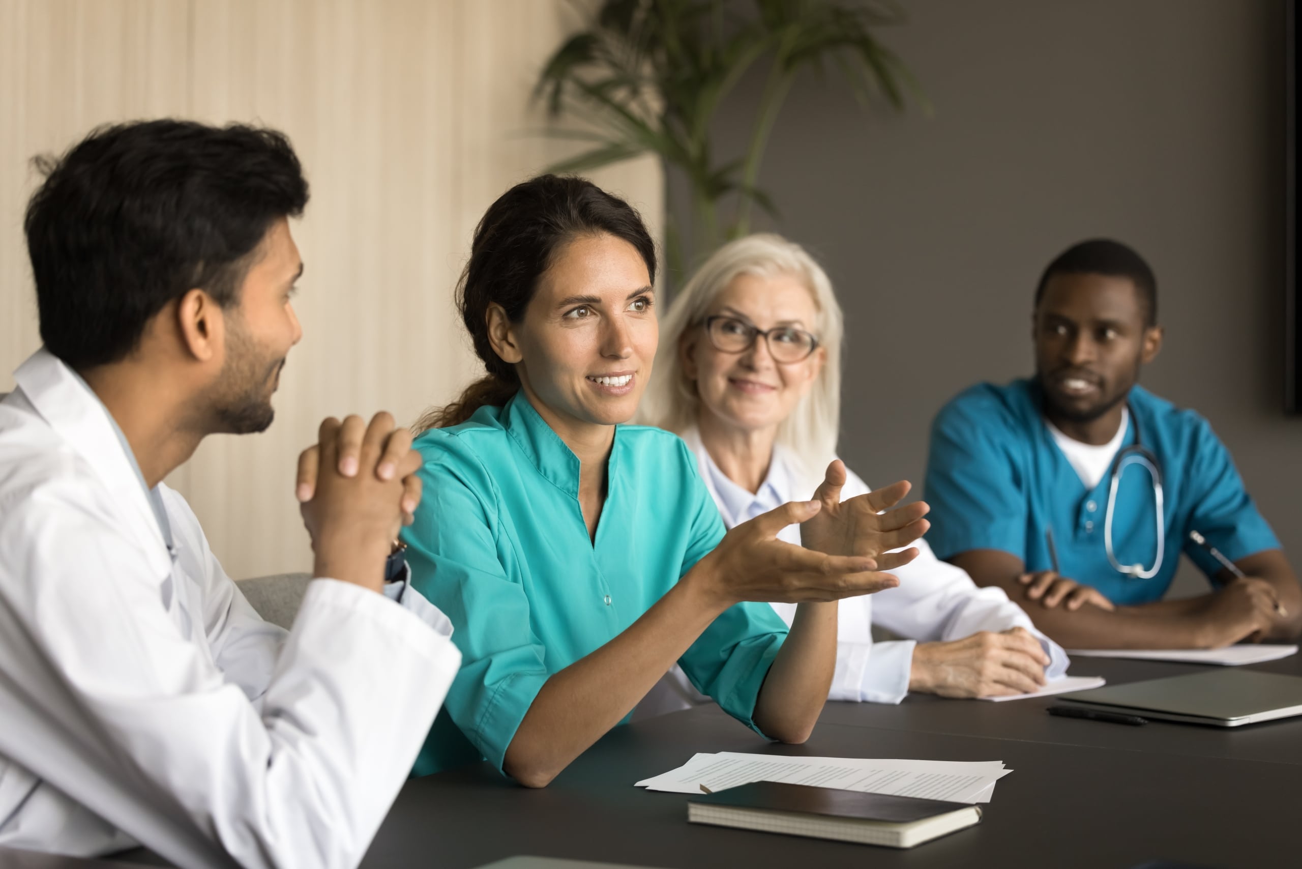 Diverse group of medical professionals at a conference table