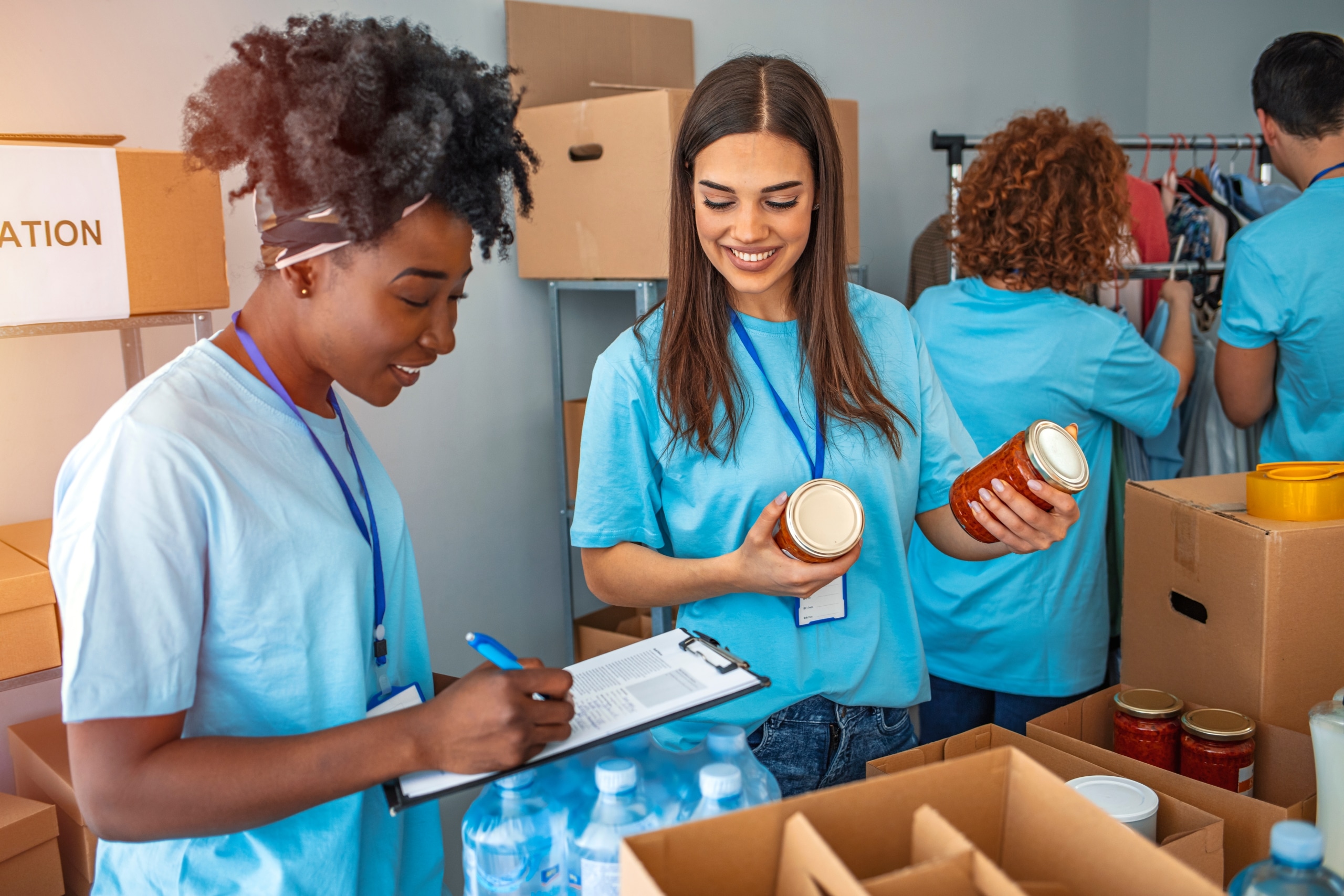 Diverse group of people gathering donations