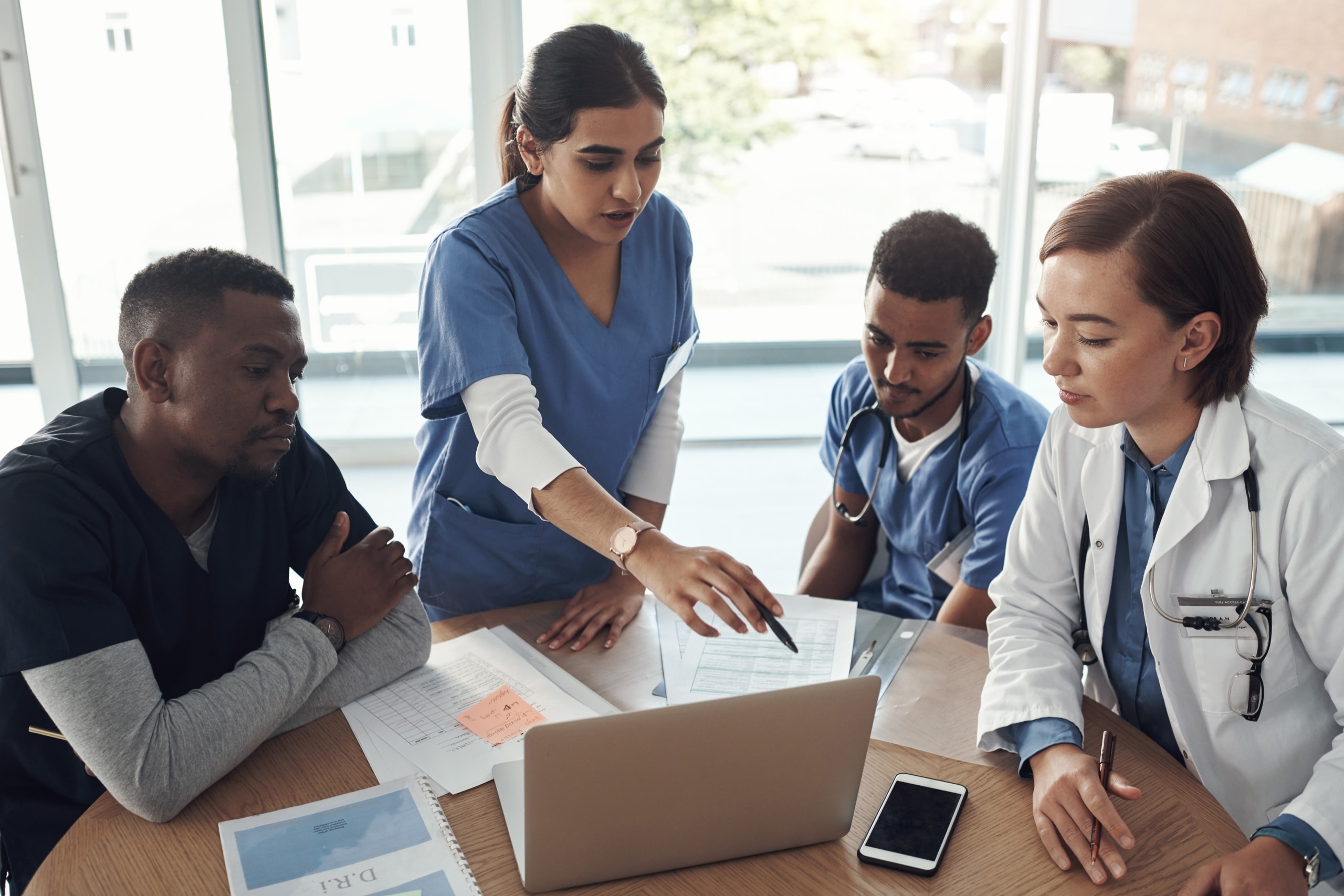 Diverse group of medical professionals at a conference table
