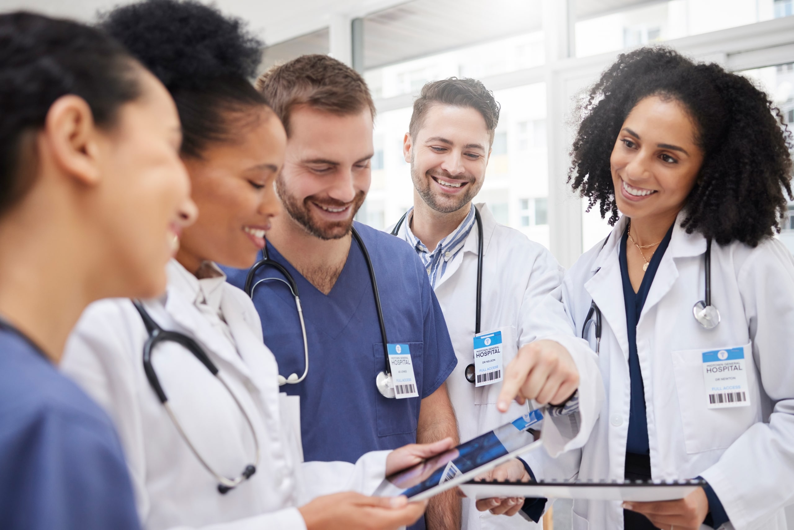 Diverse group of medical professionals speaking together
