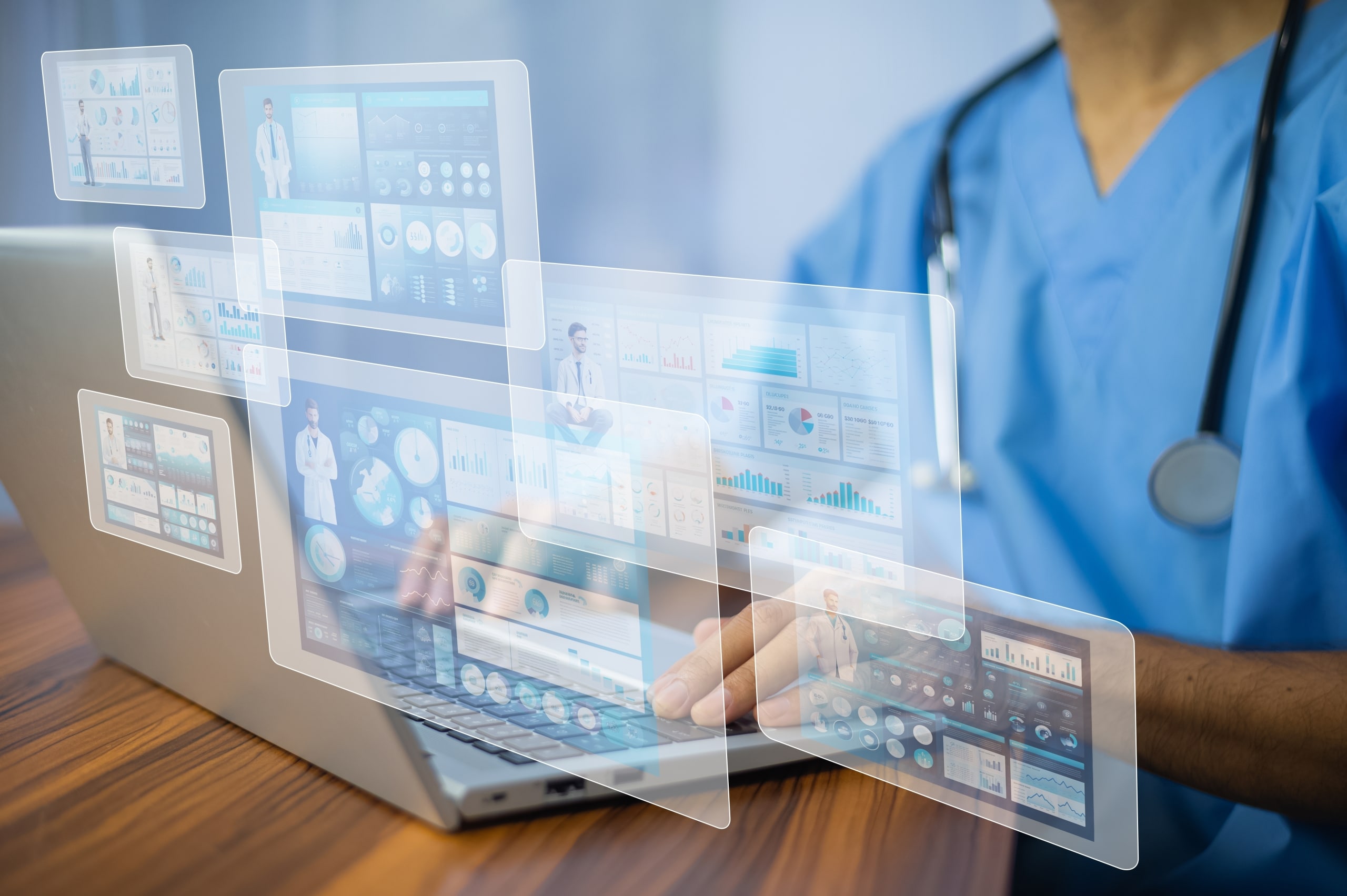 Nurse typing on a computer with virtual screens present