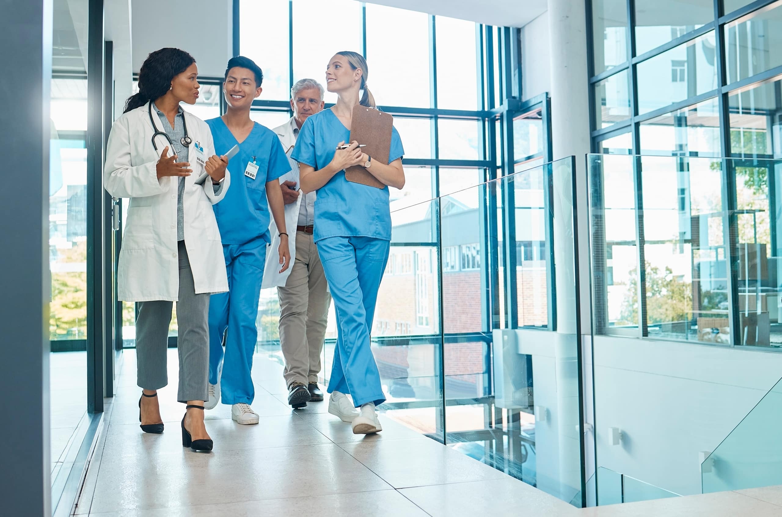 Healthcare professionals walking in a hospital hallway