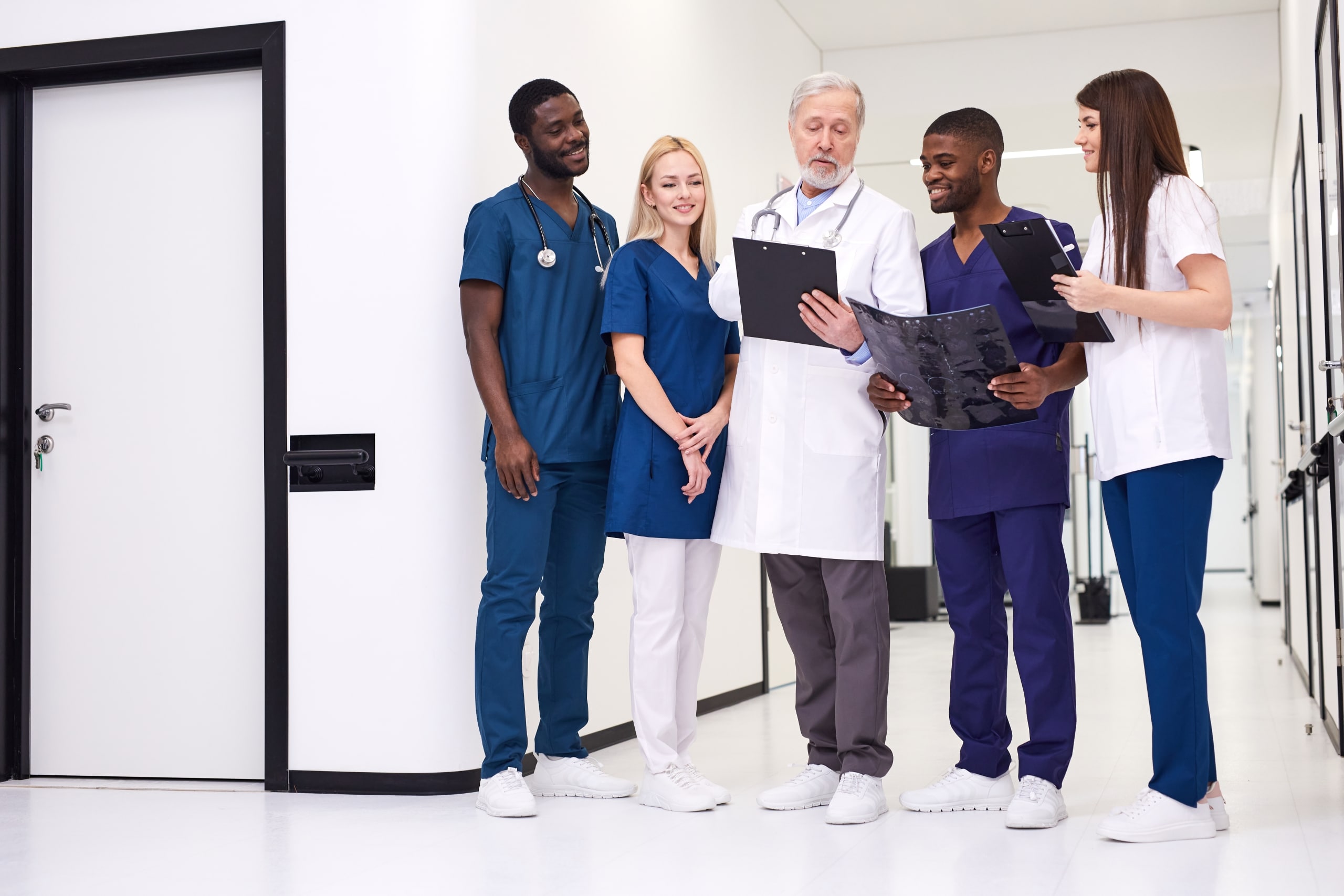 Diverse group of medical students with an instructor