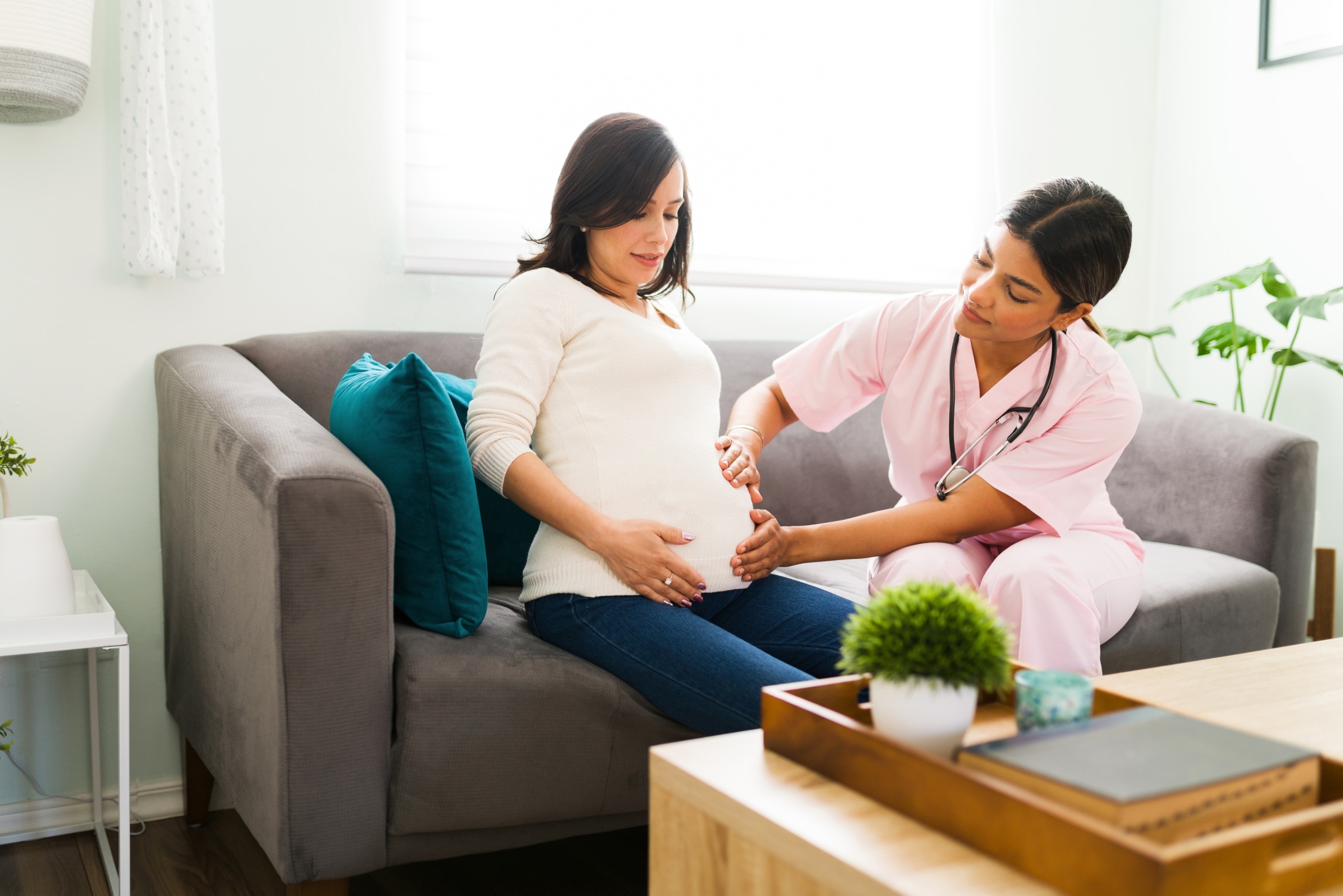 Nurse midwife with a Hispanic patient