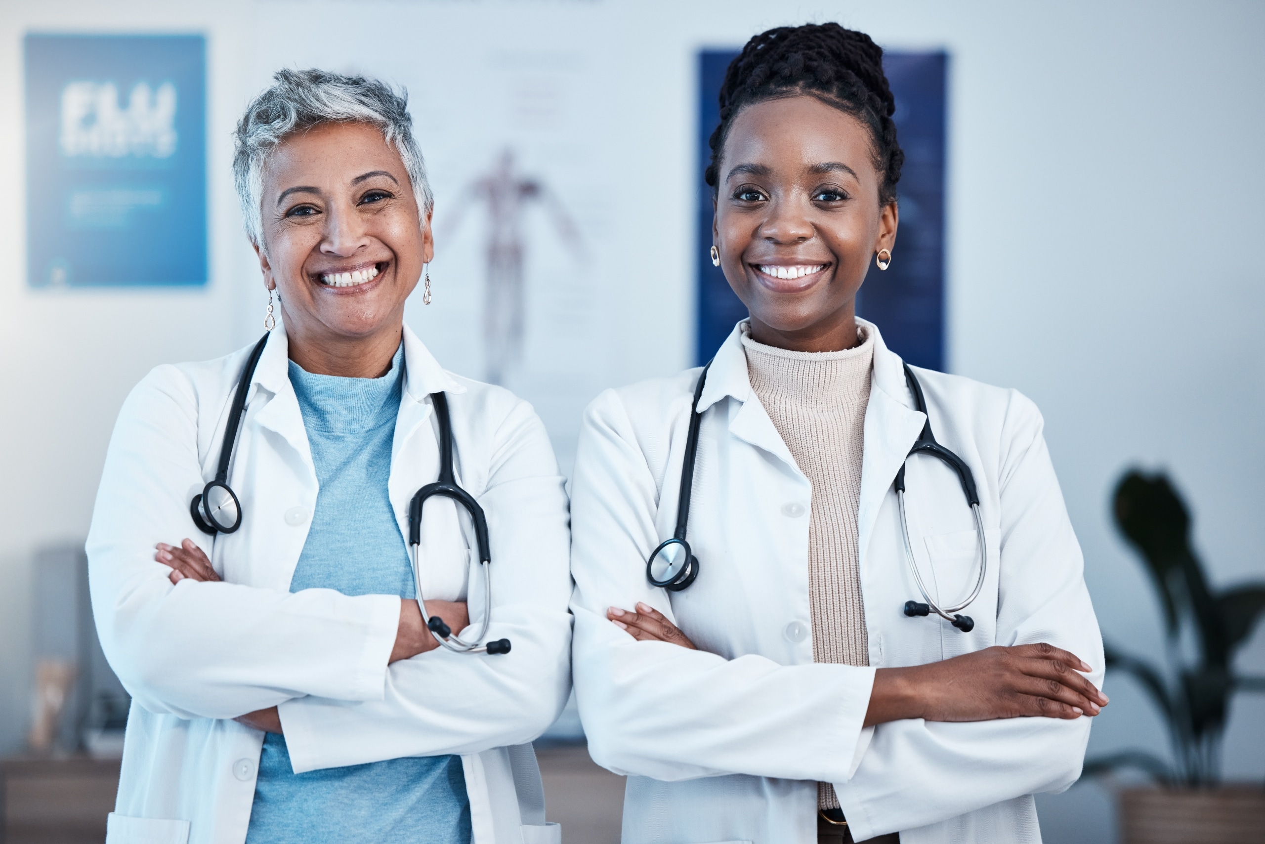 African-American medical professionals smiling with their arms crossed