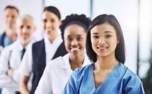 Team of diverse medical professionals standing in a line